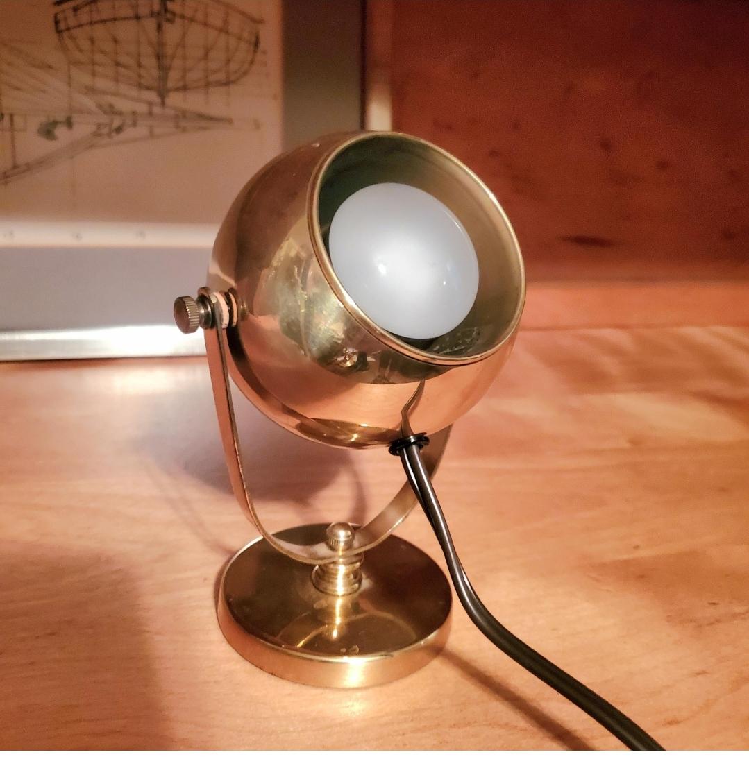GORGEOUS 60 year old brass eyeball desk spotlight/ lamp.
Perfect functionality.
Swivels and has a weighted base.
6.25