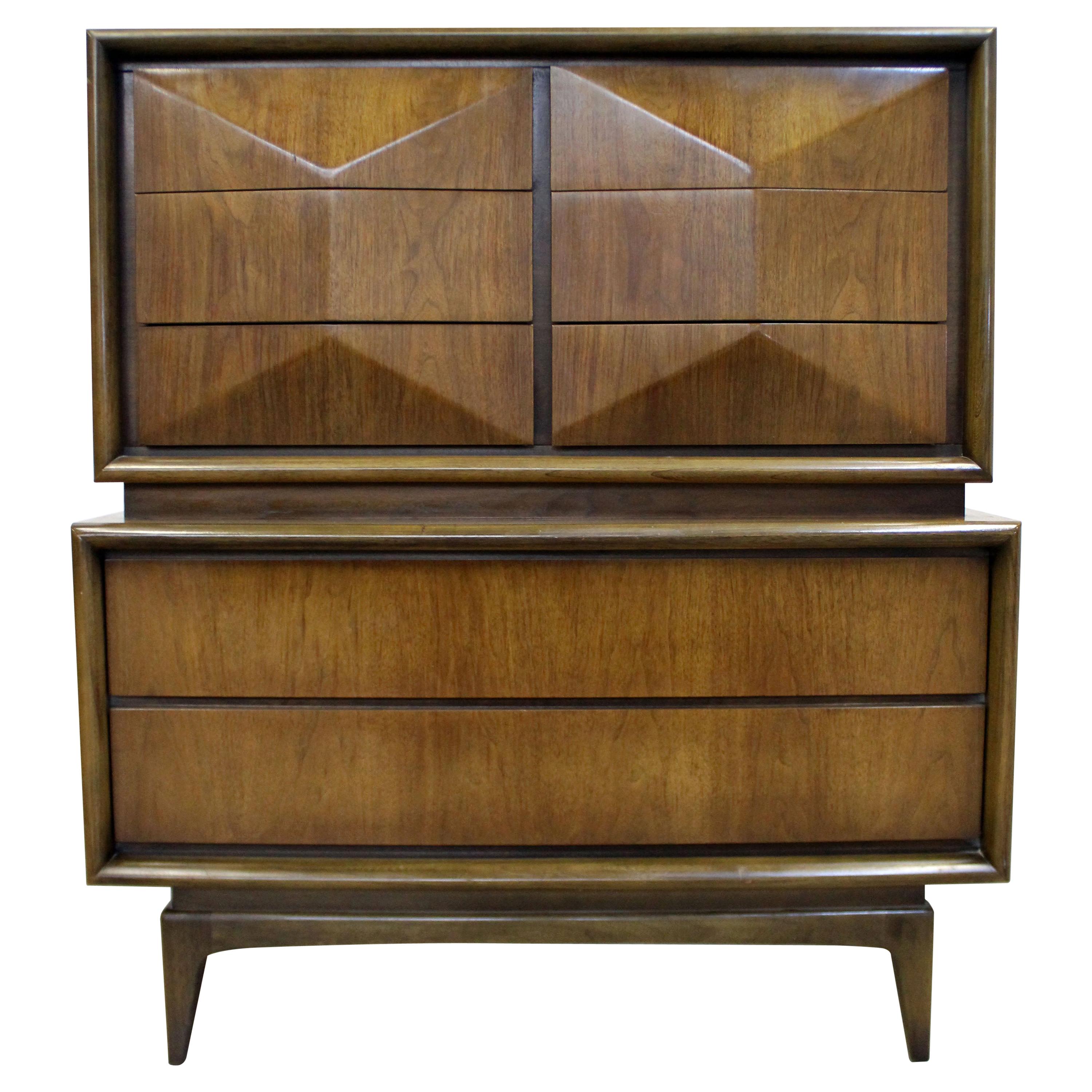 Offered is large walnut tall chest of drawers featuring a diamond style front. Includes six smaller top drawers with sculpted fronts and two large drawers on bottom with hidden side pulls. Drawers are dovetailed. It is in good condition, shows minor