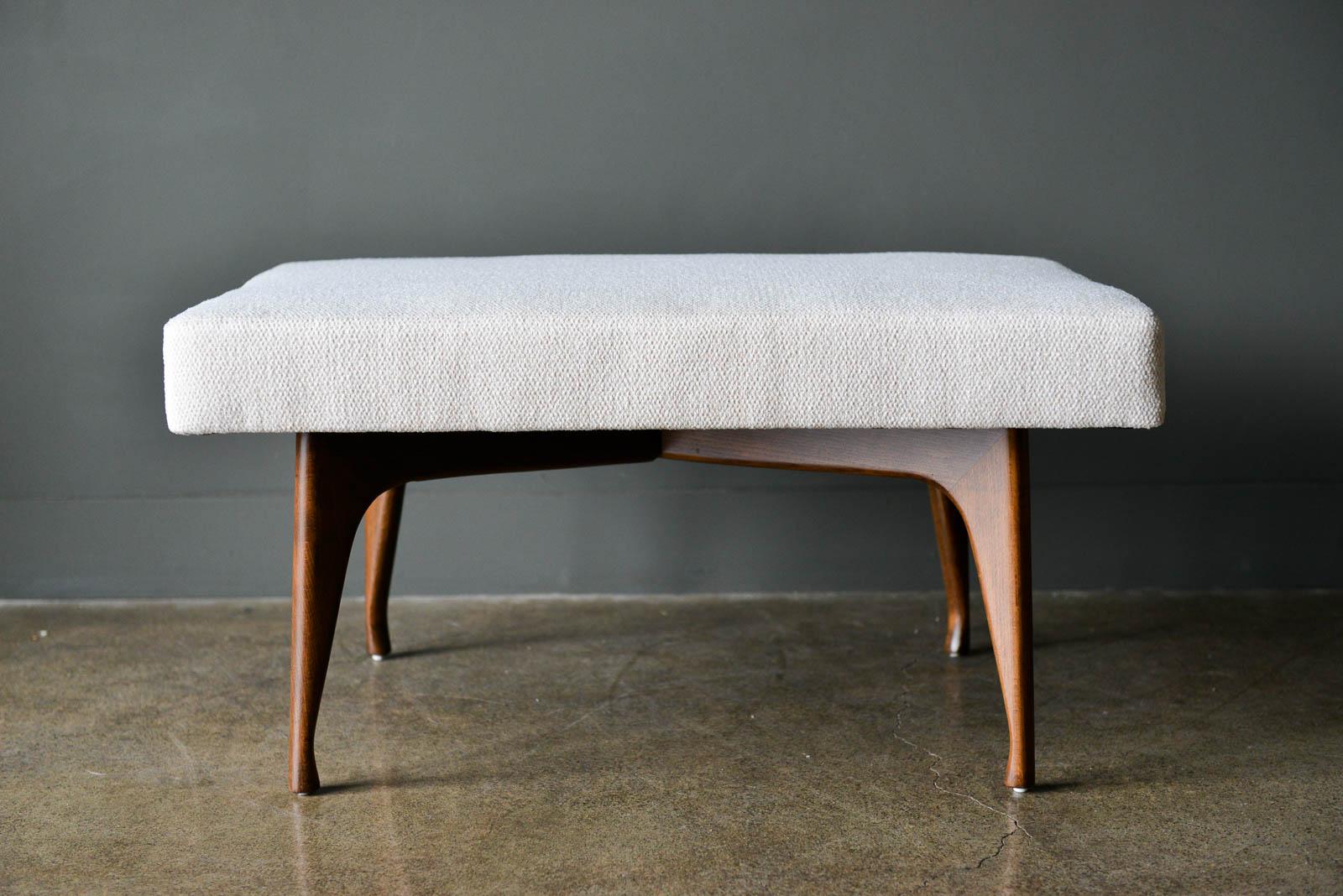 Mid-Century Modern Walnut X Base upholstered bench or footstool. Newly reupholstered in beautiful ivory fabric with walnut X or cross style base. Excellent original condition.

Measures: 30