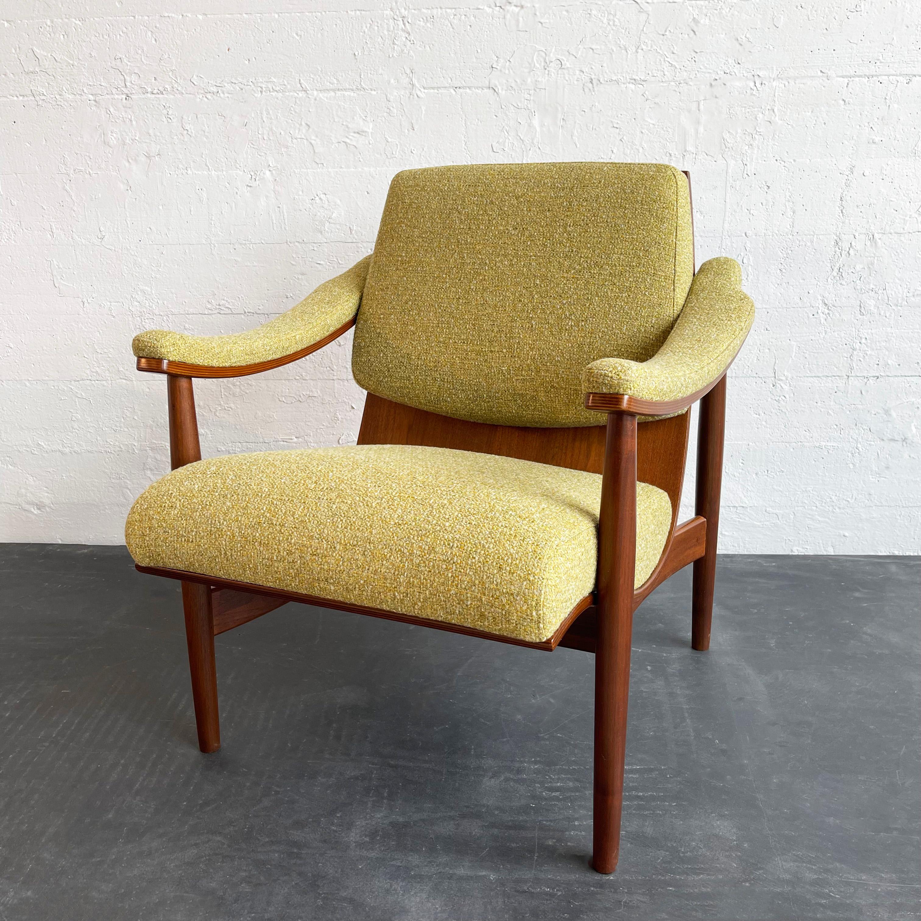 Rare, mid-century modern, walnut bentwood armchair by Thonet features a curvaceous profile with the back and seat made from a single piece of bent walnut. The segmented yellow tweed upholstery appears on the seat, back and arms and follows the lines