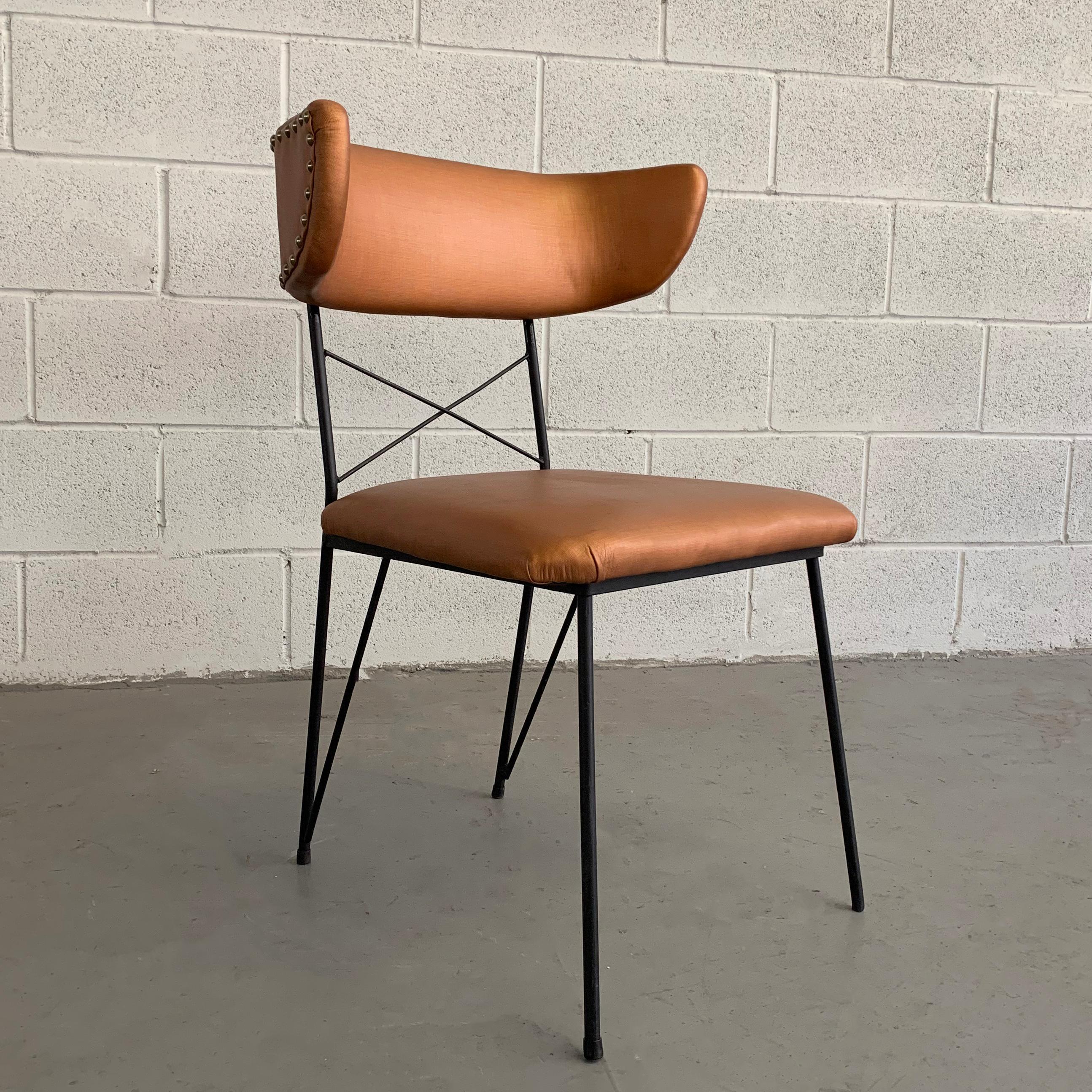 Mid-Century Modern, desk or side chair features a wrought iron frame with contrasting copper vinyl upholstery and nailhead detail on backrest.