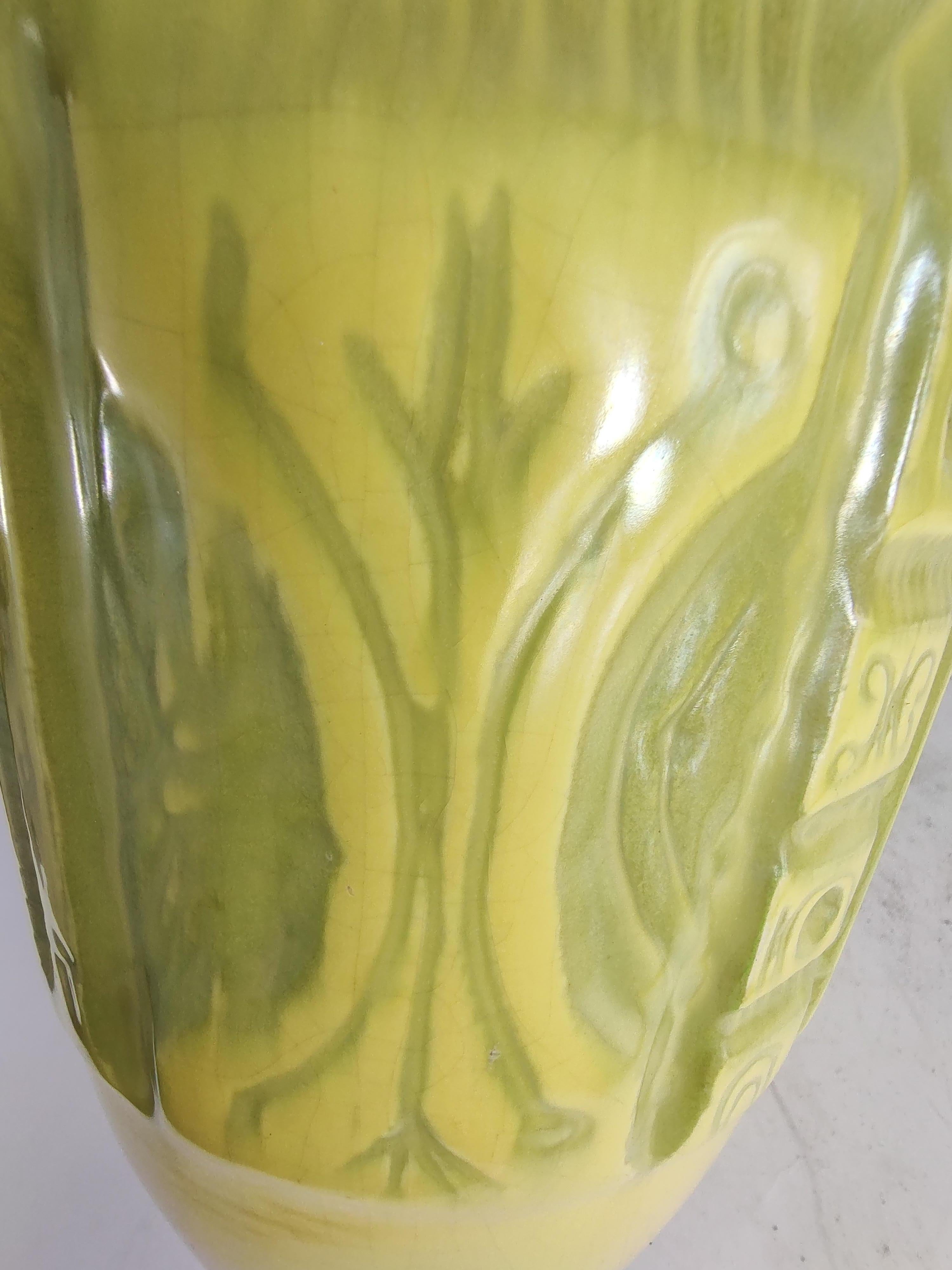 Fabulous tall & large bottle form vase in pale yellow with a multitude of all different impressions banding the perimeter of the vase. In the style of Bitossi but it is unmarked. In excellent vintage condition with a miniscule rim chip that was