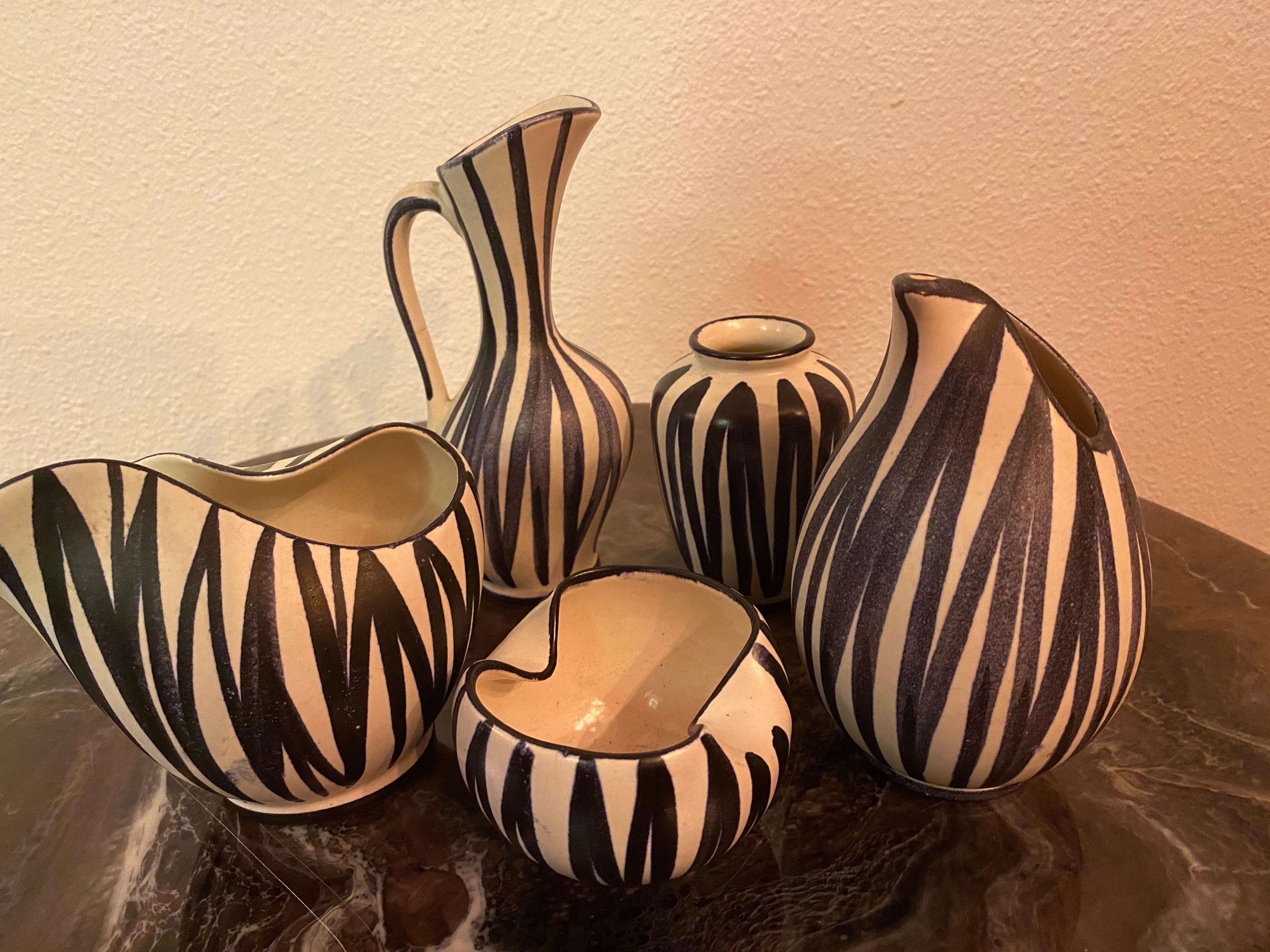 Just beautiful stylish tiny vases in matte glazing with black stripes. Typical decor and shapes from the fifties/sixties

