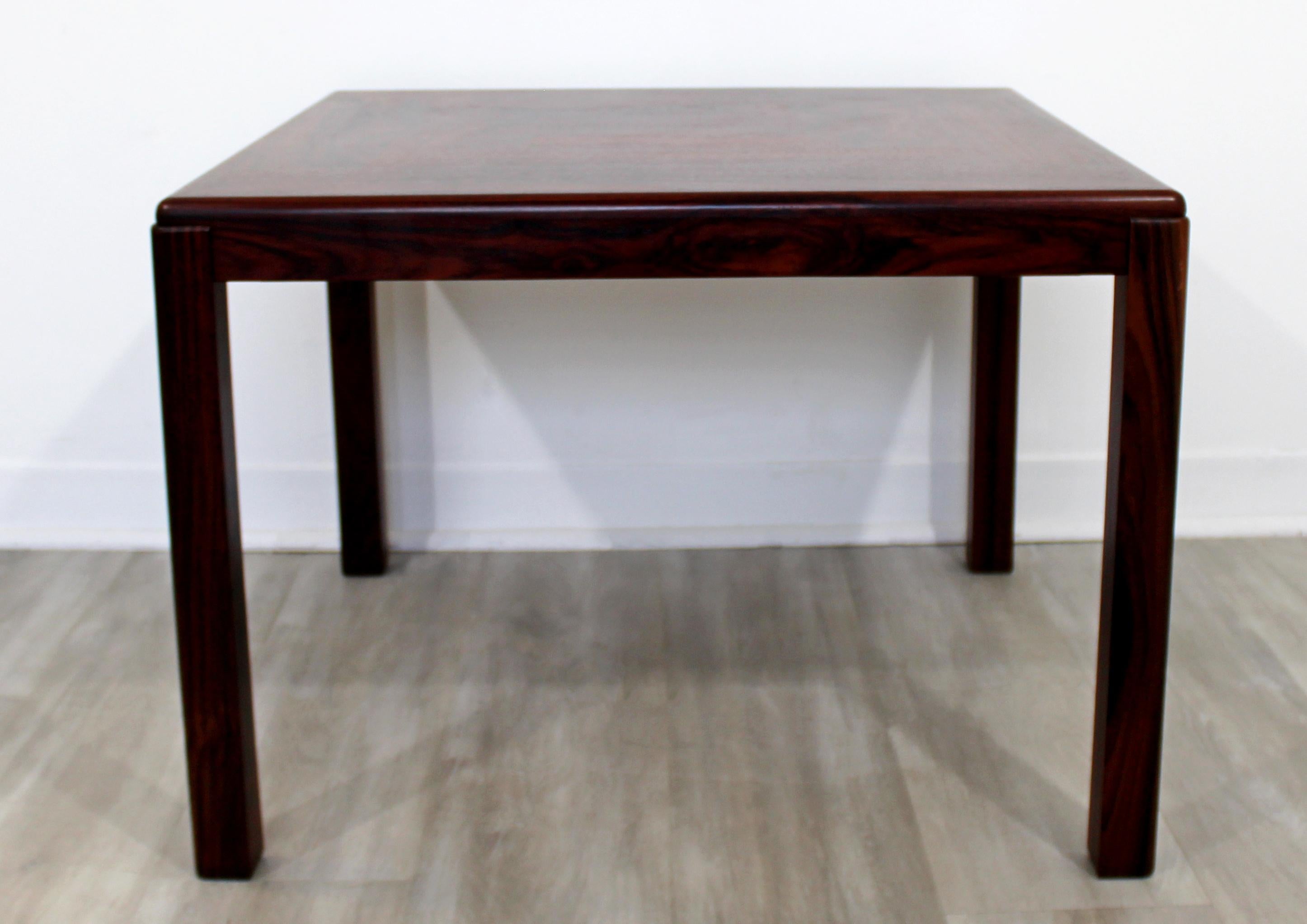 For your consideration is a sensational, solid rosewood side or small coffee table, by Vejle Stole Og Mobelfabrik, made in Denmark, circa 1960s. In excellent vintage condition. The dimensions are 27.5