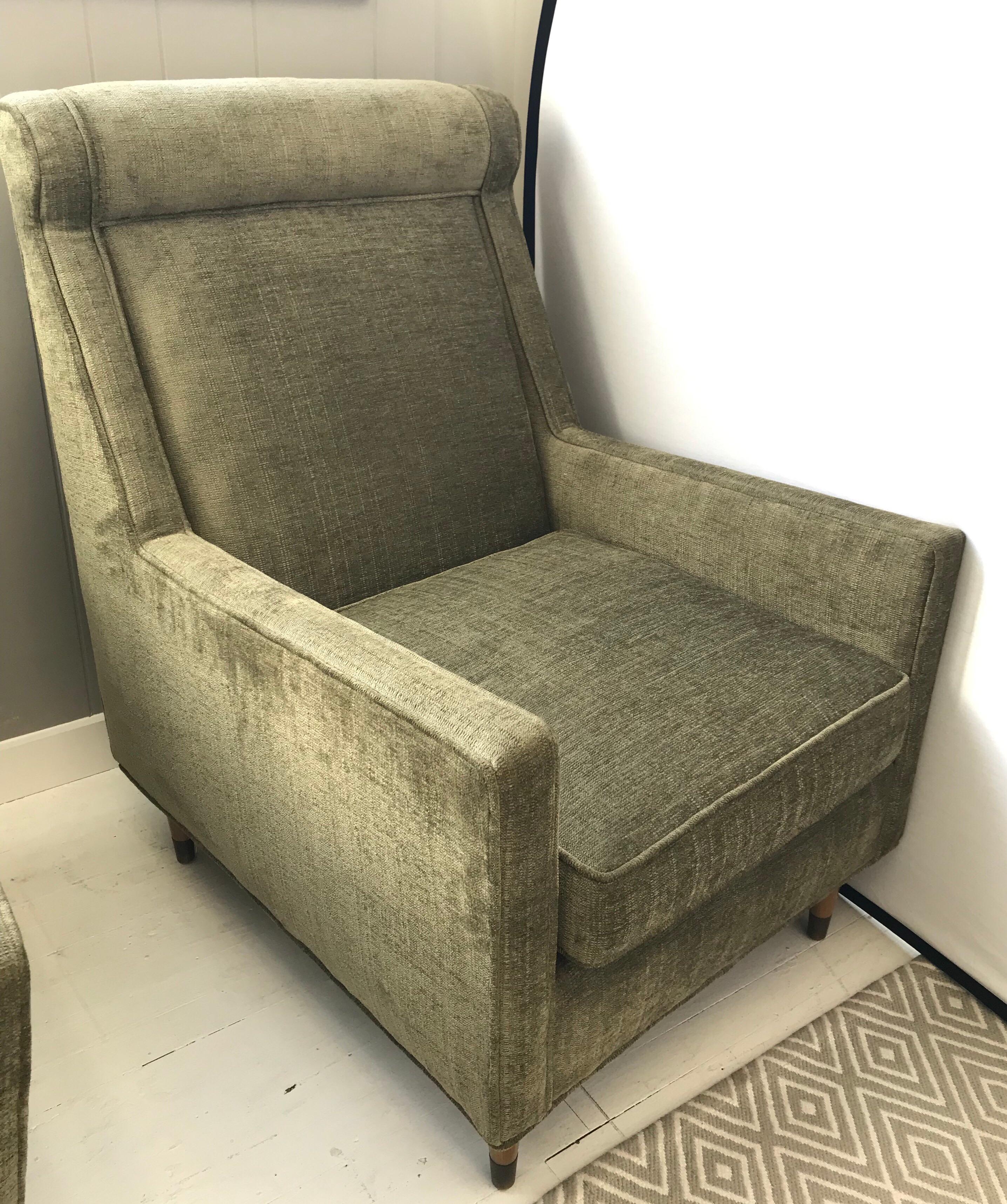 Sleek and comfortable midcentury lounge chair done in a olive green velveteen fabric.