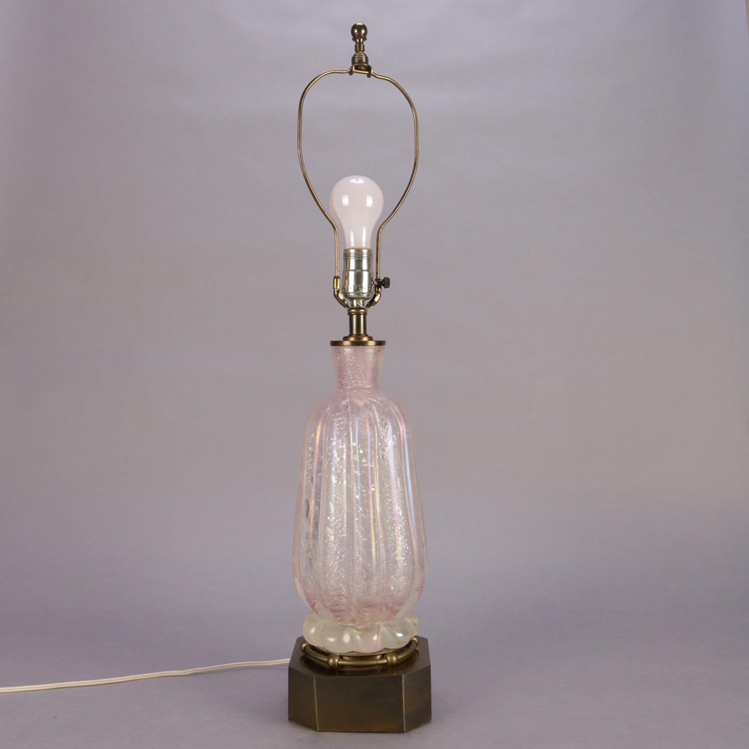 Mid-Century Modern table lamp features Venetian pink opalescent Murano glass vase seated on brass base, circa 1960

***DELIVERY NOTICE – Due to COVID-19 we are employing NO-CONTACT PRACTICES in the transfer of purchased items.  Additionally, for