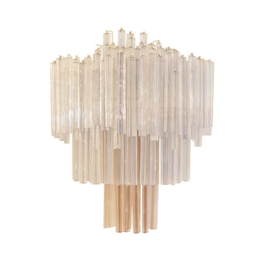 Pair of sconces manufactured by Venini. Composed of 100 different solid crystal pieces disposed in three layers. Wall-mounted metal frame and each requires five light bulbs, Italy, 1970s.