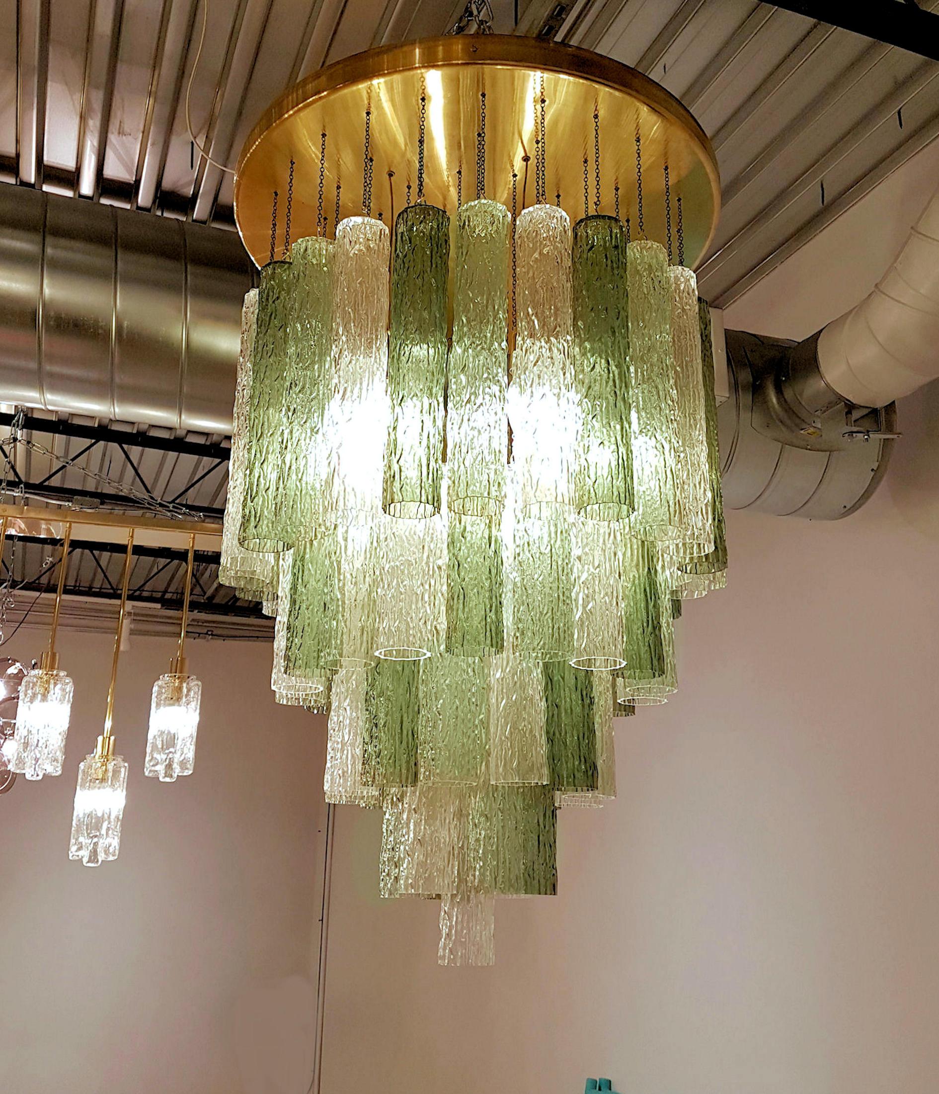 Mid-Century Modern Murano glass and brass flush mount light.
By Venini, Italy, Murano, 1960s-1970s.
3 colors of textured Murano glass tubes: transparent, light green, darker green.
Frame in brass, rewired.
Height may be shorten a little, thanks