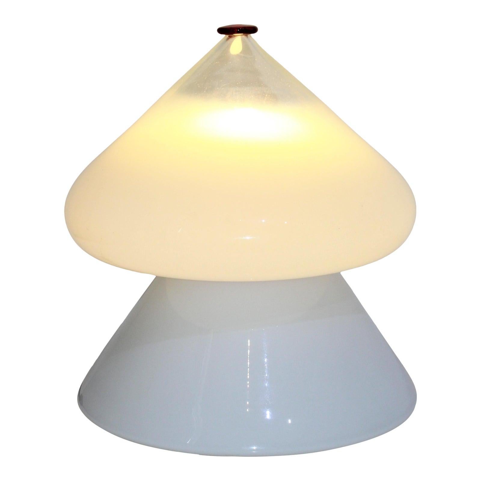 Mid-Century Modern Venini table lamp white, clear, red cap from a Palm Beach estate.

Designed as 2 pieces, and acid-etched signature on the upper piece.

There is a small blemish on the inside rim of the bottom piece - see photo.