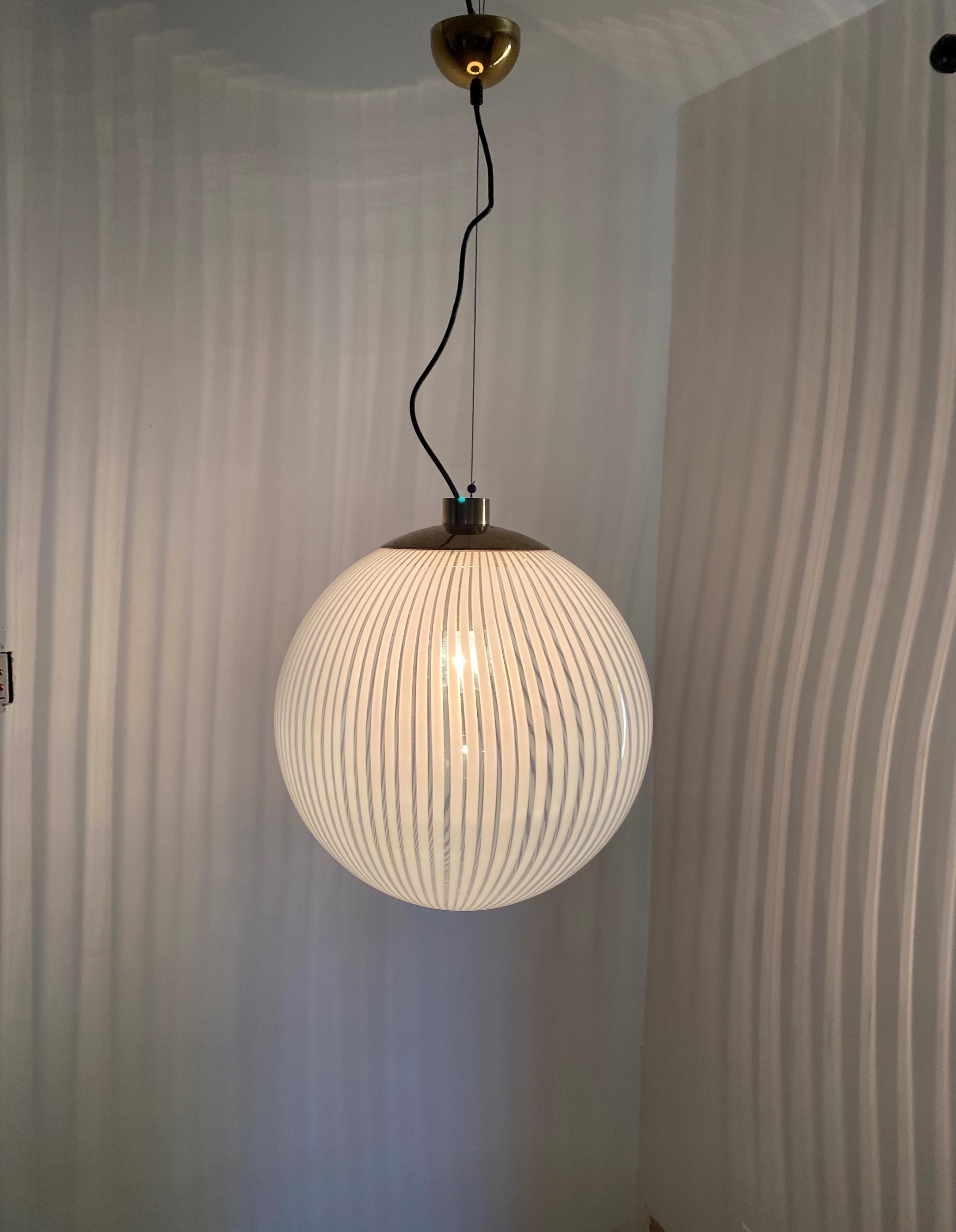 Large Mid-Century Modern pendant light in white and clear hand blown Murano Glass in the 