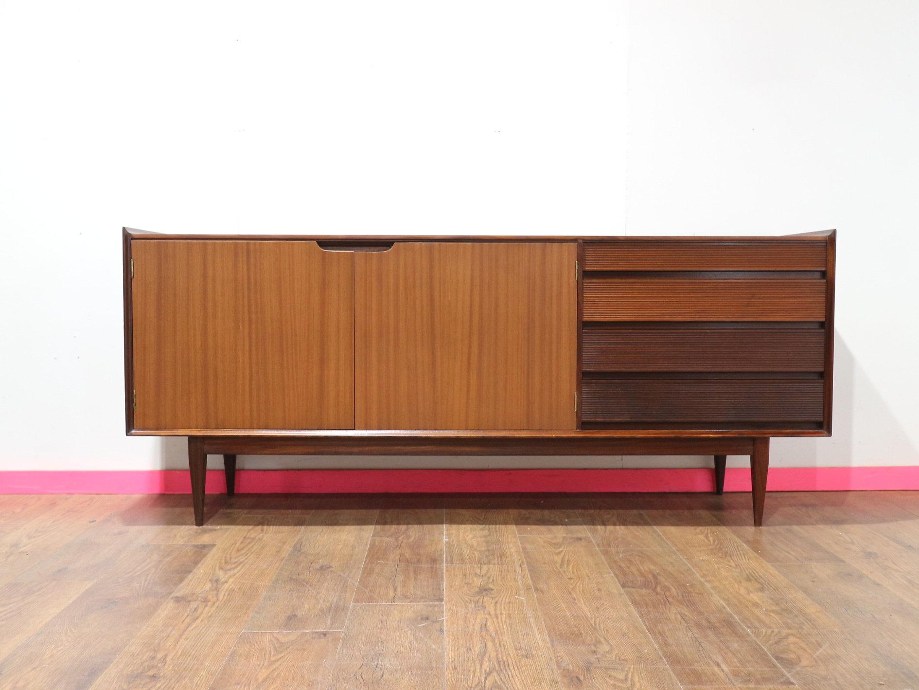 A stunning mid-century credenza by British furniture maker Richard Hornby, crafted from luxurious afromosia teak. This piece exemplifies fantastic quality with its excellent craftsmanship and attention to detail. It offers great storage space and