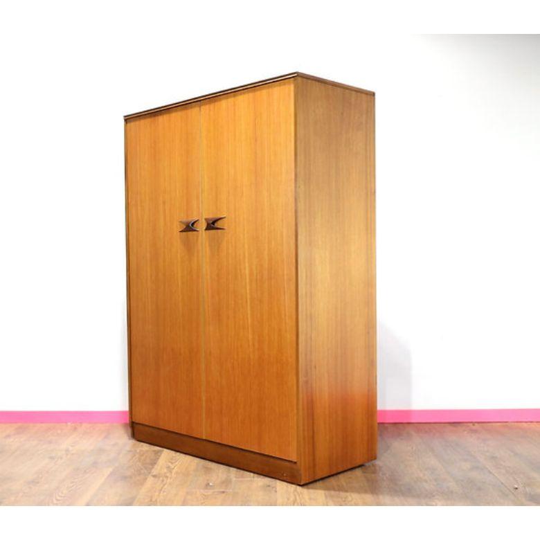 A stunning armoire by British furniture maker Elliots of Newbury.  The fantastic handles on this beautiful armoire make it stand out from the crowd and it offer plenty of hanging storage.

Dims
w48 d22.5 h69.5 

Condition
This armoire is in great