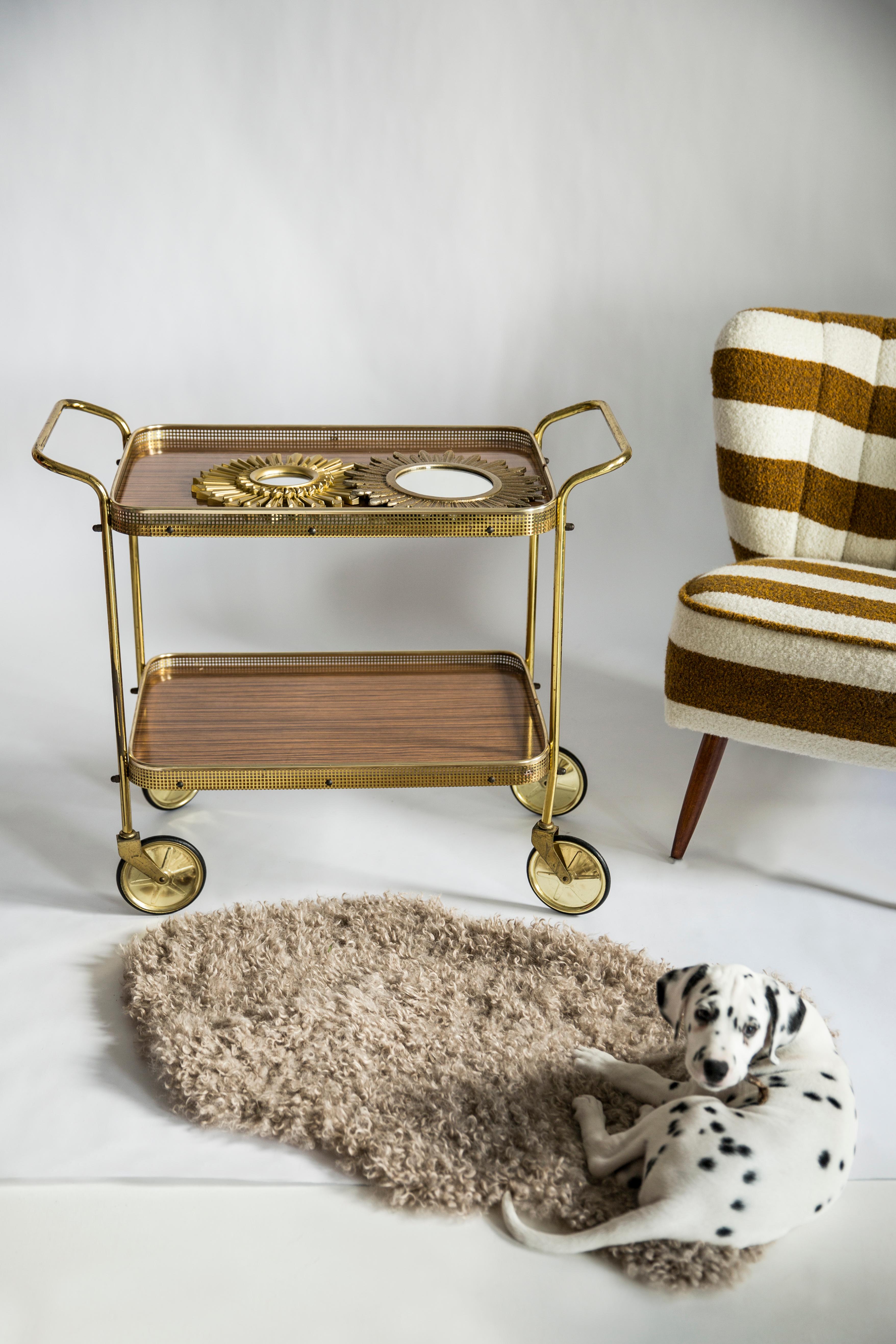 Beautiful bar cart from the 1960s. It was manufactured in France, Europe in 1960s. The table was made of wood, it was also renovated. Good condition. Unique shape.