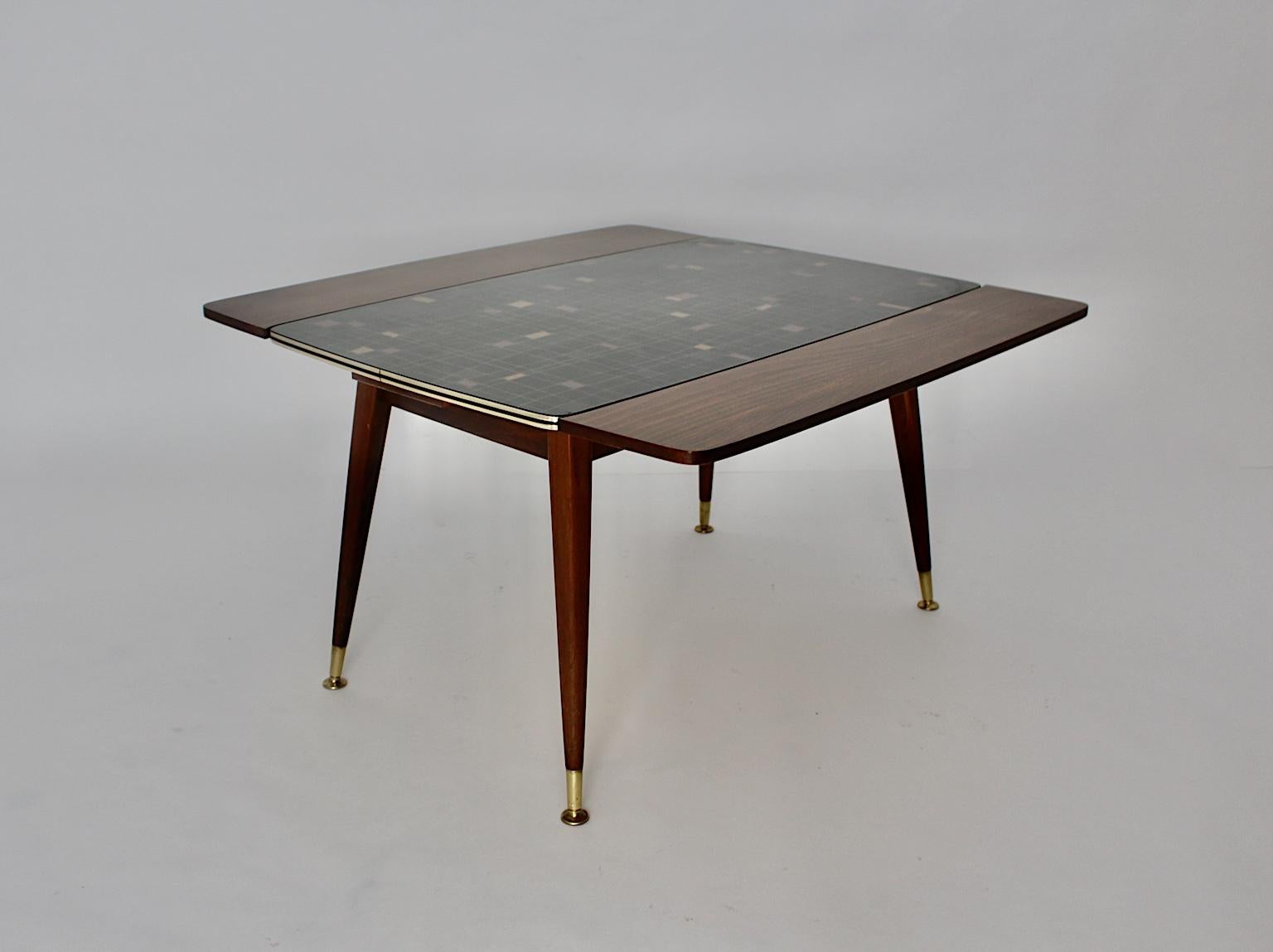 A Mid-Century Modern vintage beech brass sofa table or dining table, which was created and designed 1950s Vienna.
The sofa table or dining table was made of beech, pressboard, formica, metal and brass. A great design feature is an adaptability of