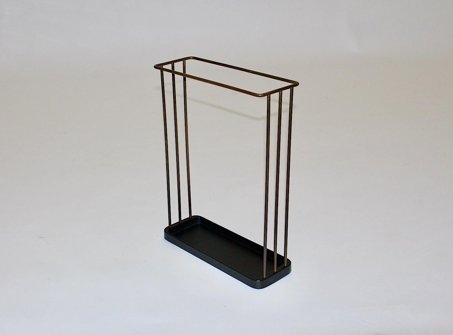 Mid-Century Modern vintage umbrella stand from black iron and brass by Franz Hagenauer for Workshop Hagenauer, 1950s, Austria.
Franz Hagenauer ( Vienna 1906 - 1986 )
A gorgeous umbrella stand from black cast iron with a solid brass