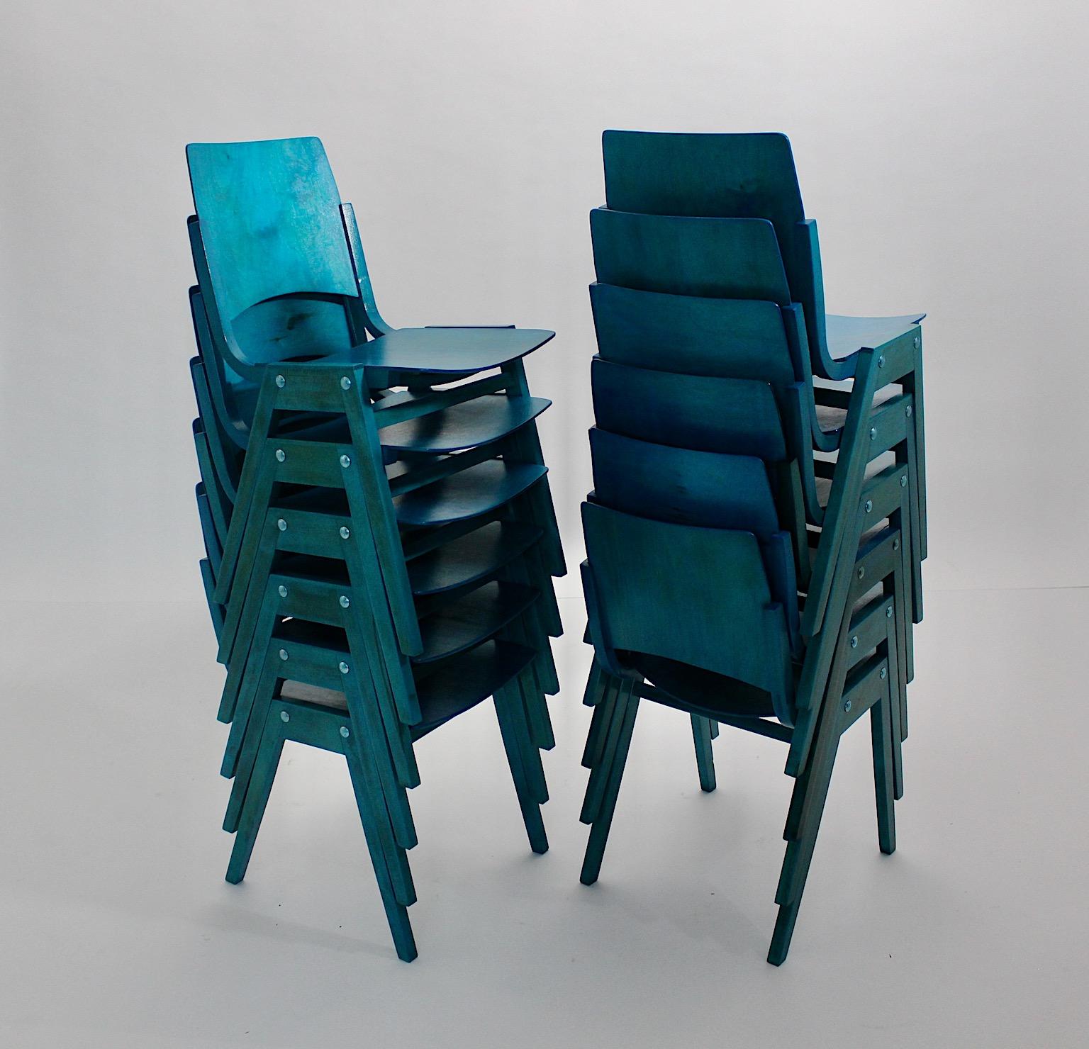Mid-Century Modern twelve ( 12 ) dining chairs or chairs from beechwood and plywood in ocean blue teal color tone by Roland Rainer 1952 Vienna for Emil and Alfred Pollack. 
A gorgeous set of twelve ( 12 ) dining room chairs by Roland Rainer 1952
