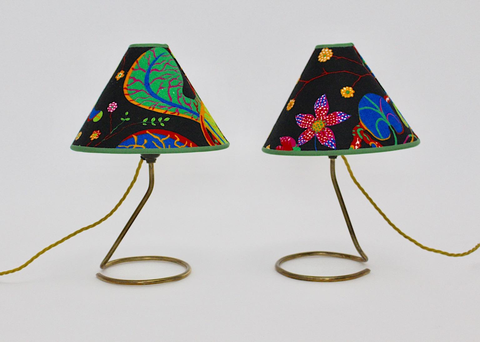Brass vintage Mid Century Modern pair of table lamps or bedside lamps by J.T. Kalmar with beautiful lush Josef Frank design fabric by Svenskt Tenn. 
An amazing and playful pair of bedside lamps or table lamps by J.T.Kalmar 1950s from brass curved