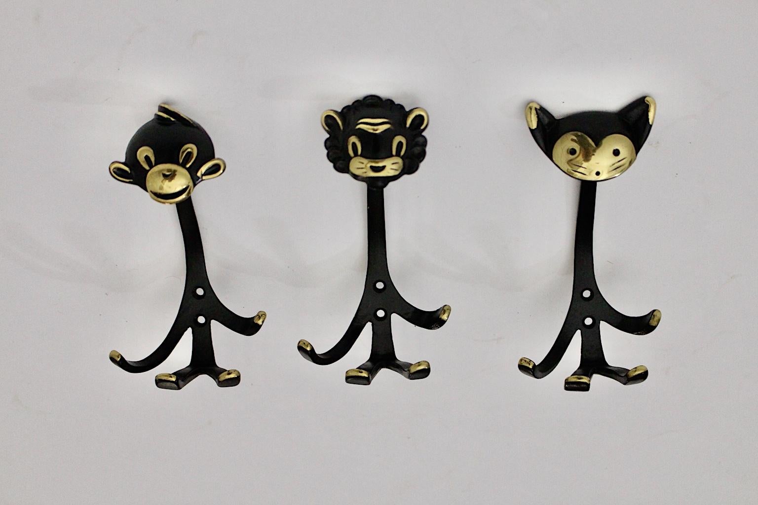 Mid-Century Modern vintage brass black set of 3 wall hooks in animal form, 1950s, Austria.
The wall hooks are easy to fix with two screws.
The vintage condition is very good with some signs of age and use.
Approx. measures:
Width 9 cm
Depth 8.5