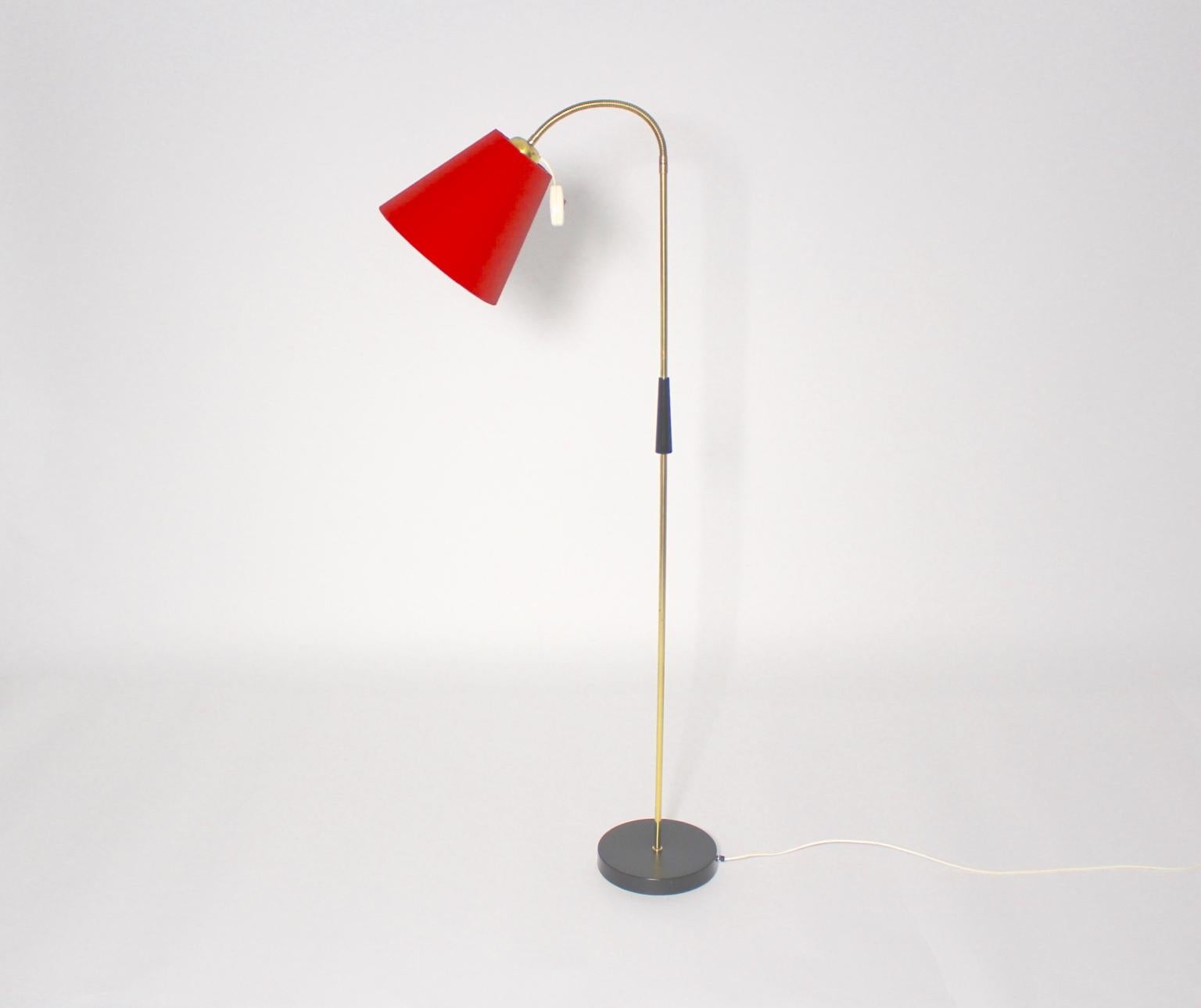 Mid Century Modern vintage floor lamp from brass 1950s Austria.
This wonderful floor lamp shows a flexible brass stem and features an adjustable height.
The adjustable height is possible to turn up with the flexible brass tube.
Furthermore the base