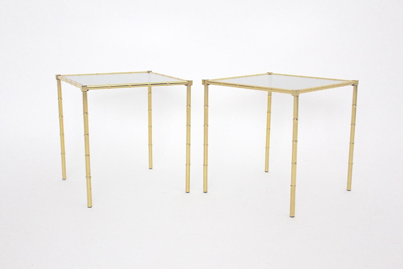 Mid Century Modern vintage brass faux bamboo side tables sofa tables pair duo with greenish glass plate 1960s France.
A charming pair or duo of side table or sofa table from brass in faux bamboo optic 1960s France.
This pair of side tables features