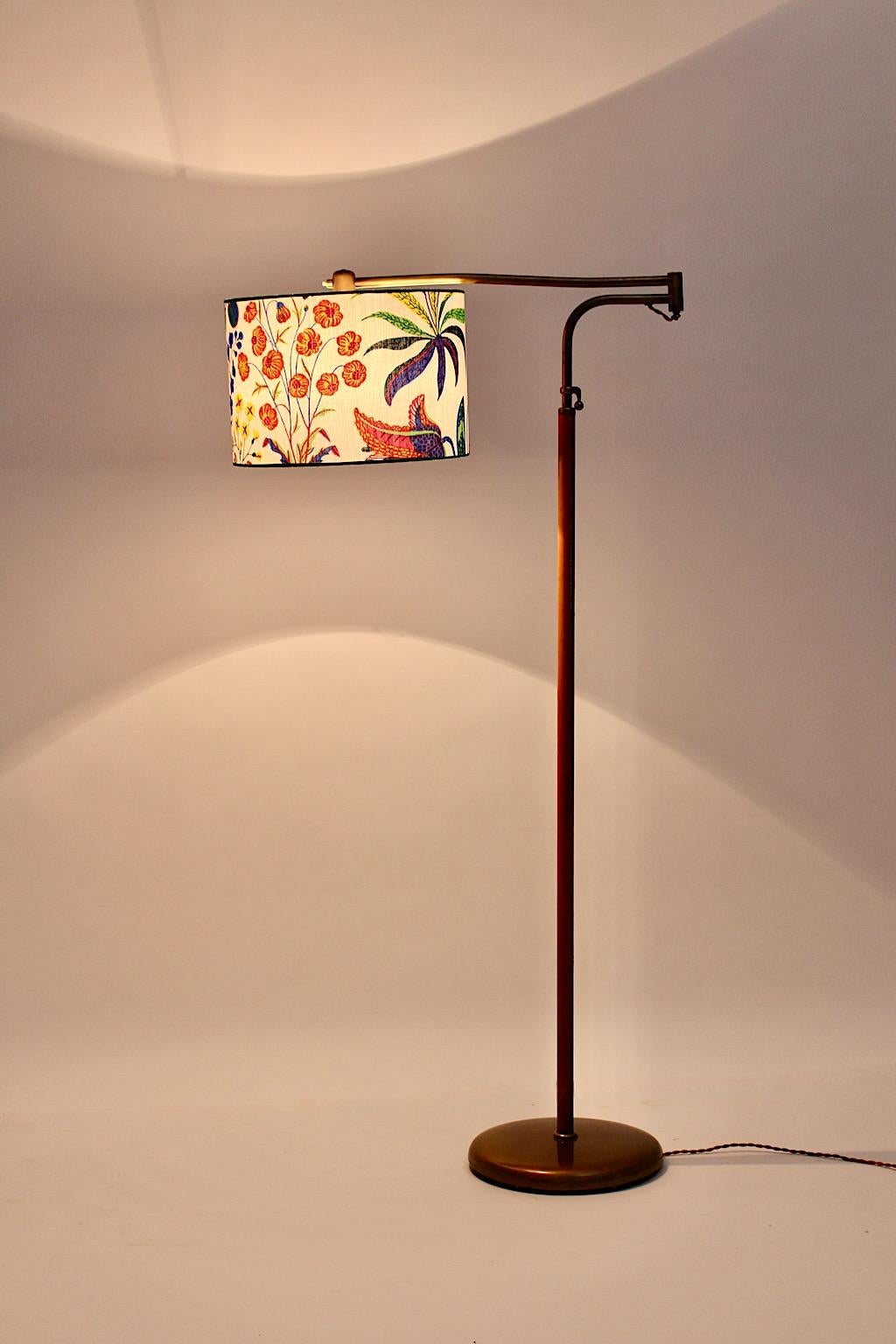 Mid Century Modern vintage floor lamp from brass and leather by J.T.Kalmar 1946 Vienna.
A gorgeous iconic floor lamp from brass and hand stitched leather in brown color by J.T. Kalmar 1946 with a circular iron base encased with brass.
Embossed