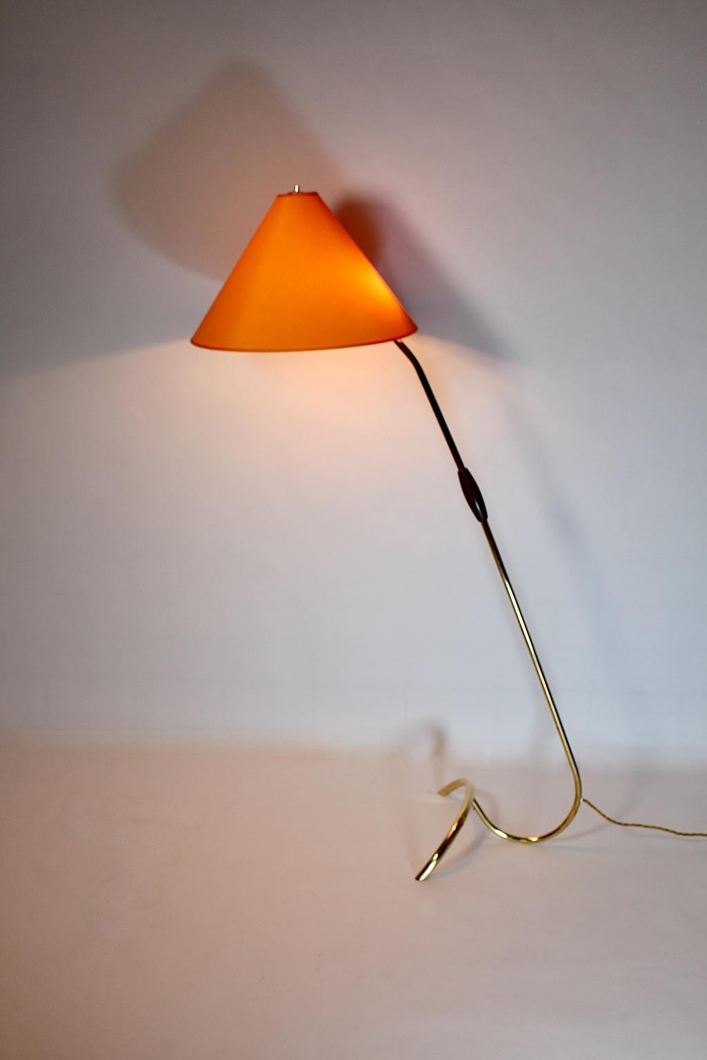 Mid-Century Modern vintage floor lamp by Rupert Nikoll from brass 1950s Vienna.
A gorgeous floor lamp from curved brass tube in iconic shape by Rupert Nikoll, 1950s Vienna.
This floor lamp based on a curved brass tube with a stem and a wooden