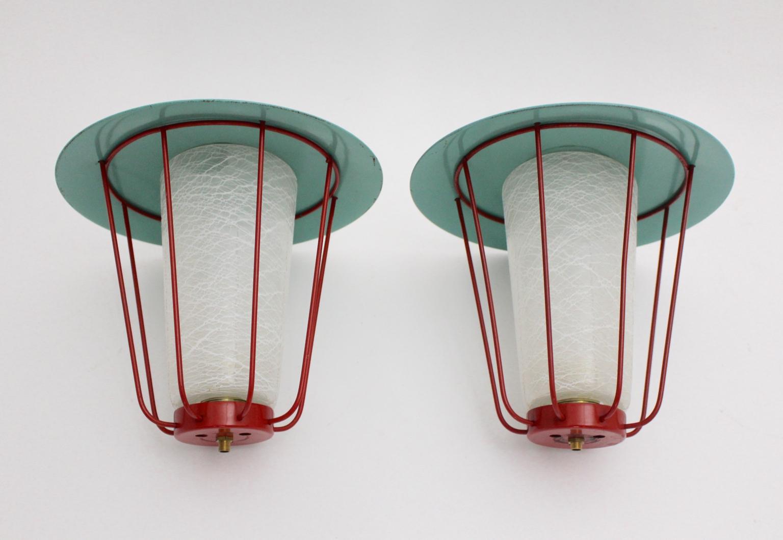 This pair of metal lanterns was designed and made in Vienna circa 1960 by J.T.Kalmar.
In the midcentury period the lighting firm Kalmar manufactured and designed the most innovative light designs and was one of the most important lighting