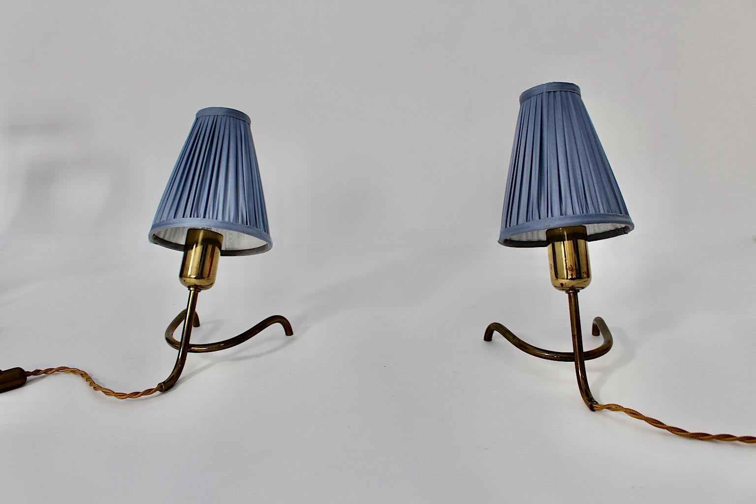 Mid Century Modern Vintage Brass Table Lamps Pair Duo with new pastel blue lamp shades from pleated silk, 1950s Austria.
A stunning pair table lamps from brass with clawfoot base and 
new handmade lamp shades from pleated silk in pastel blue color