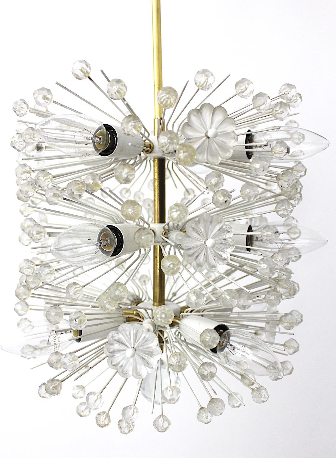 Mid-Century Modern vintage chandelier flower dandelion from white metal and brass designed by Emil Stejnar, circa 1955 and executed by Rupert Nikoll, Vienna.
A fabulous chandelier from brass, acrylic flowers and cut crystal globes dandelion like