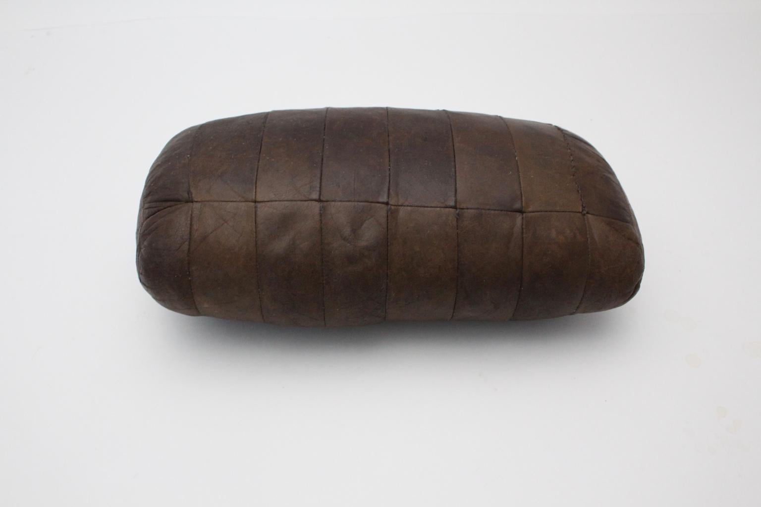 A mid century modern vintage pillow by De Sede 1970, Switzerland, was made of brown leather patchwork and shows a charming leather patina. The condition is fair.
Approximate measures:
Width 50 cm
Depth 24 cm
Height 16 cm.