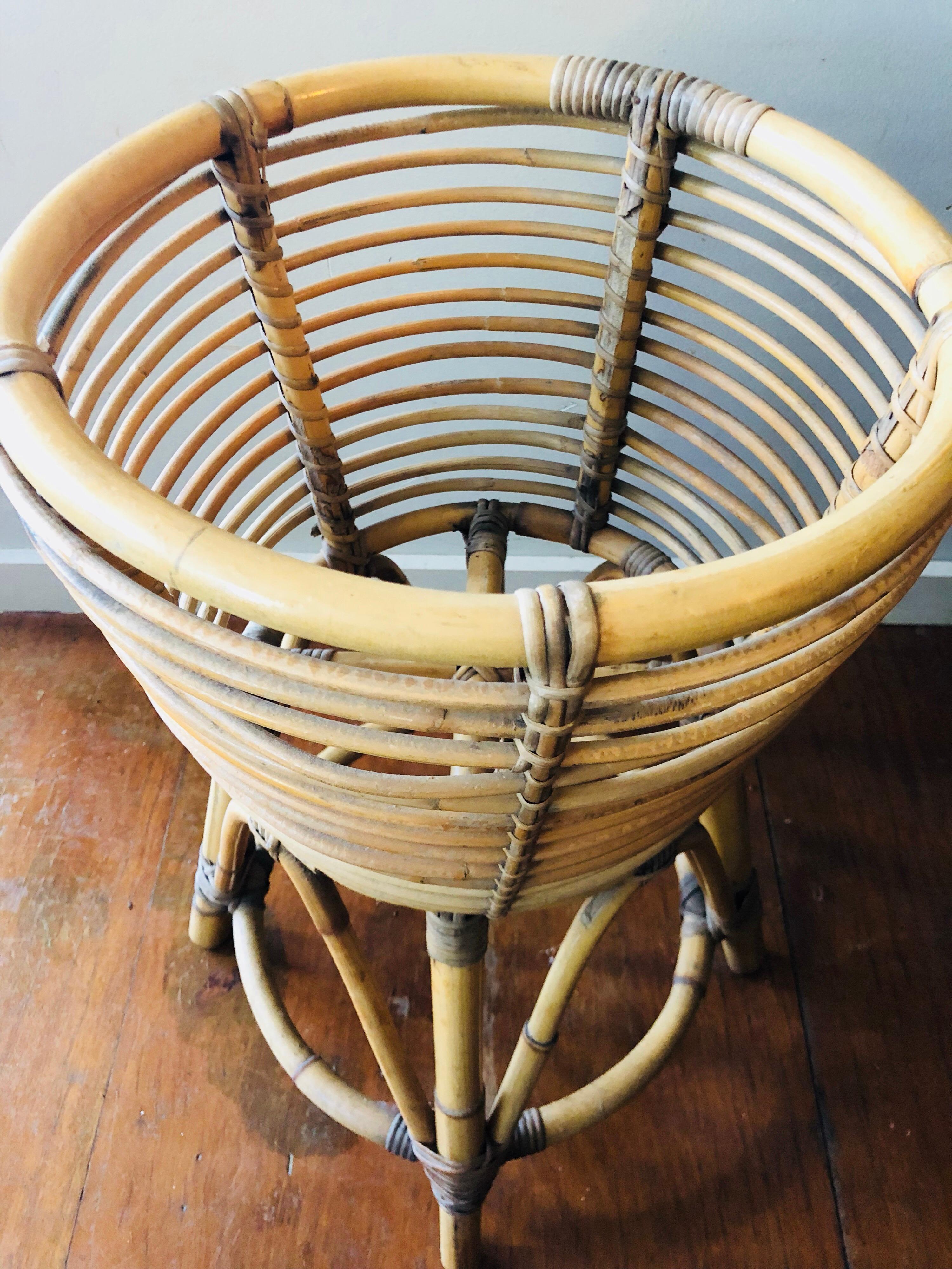 Midcentury cane and rattan quad footed planter 
Nice color and definition 
Iconic lines.
