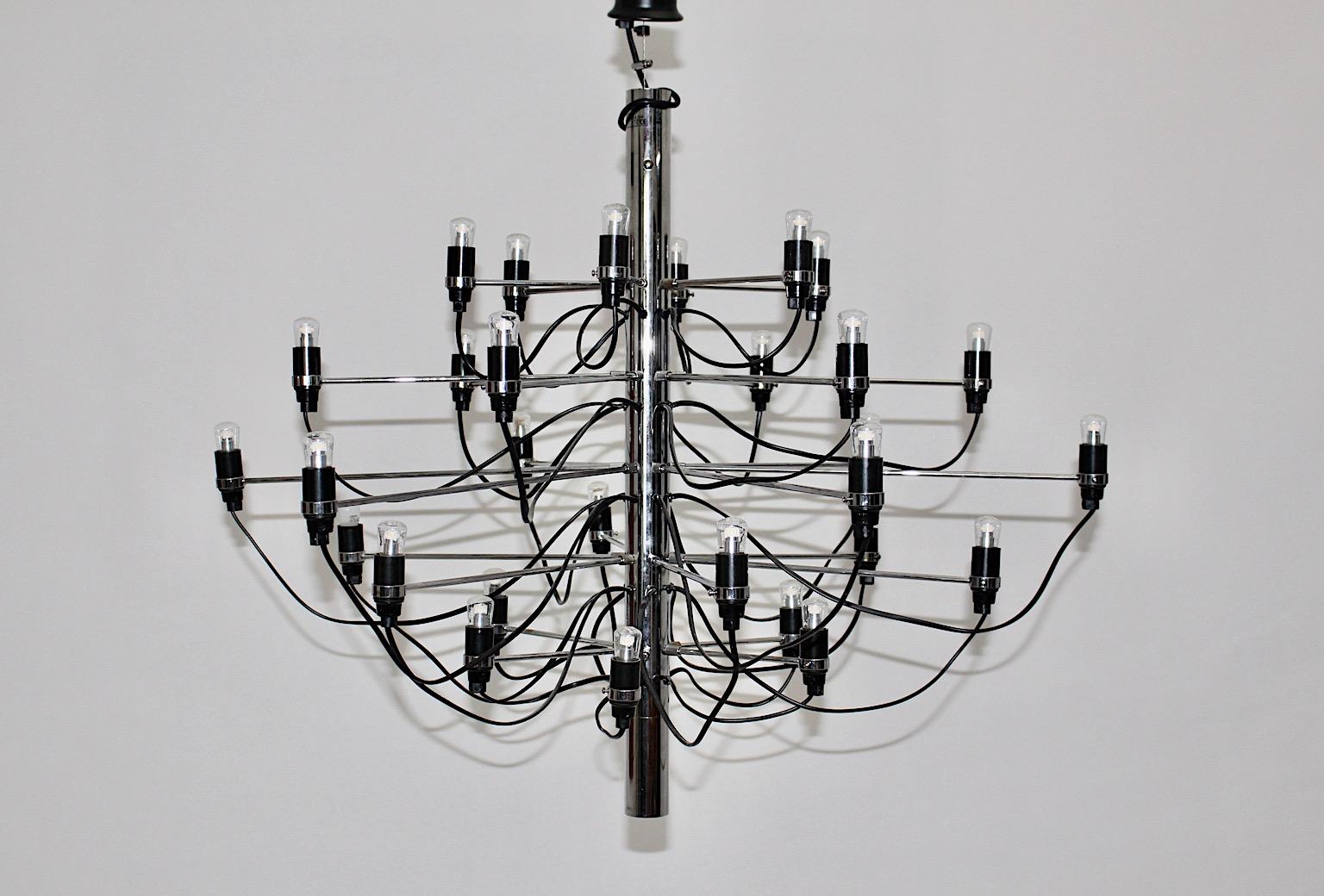 Mid-Century Modern Vintage silver and black Chandelier or Pendant designed by Gino Sarfatti 1958 and manufactured for Flos 21st century from chromed metal and 30 LED bulbs.
An iconic and beautiful sleek chandelier model 2097 designed by Gino