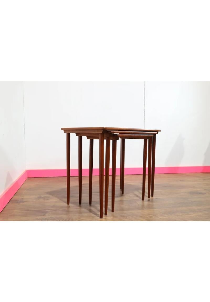 A beautiful set of nesting tables with Danish influence.  A beautiful grain and elegant legs make these tables really stand out.