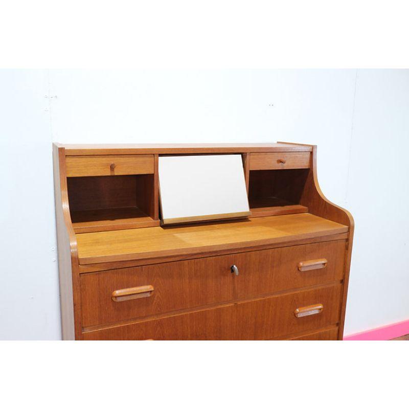 A rather special (late 1950s / early 1960s) Danish teak secretaire by AG Spejl Kobberbeskyttet with the added feature of a pull-out  mirror  transforming the bureau into a vanity unit as required. In beautiful condition with the centrally positioned