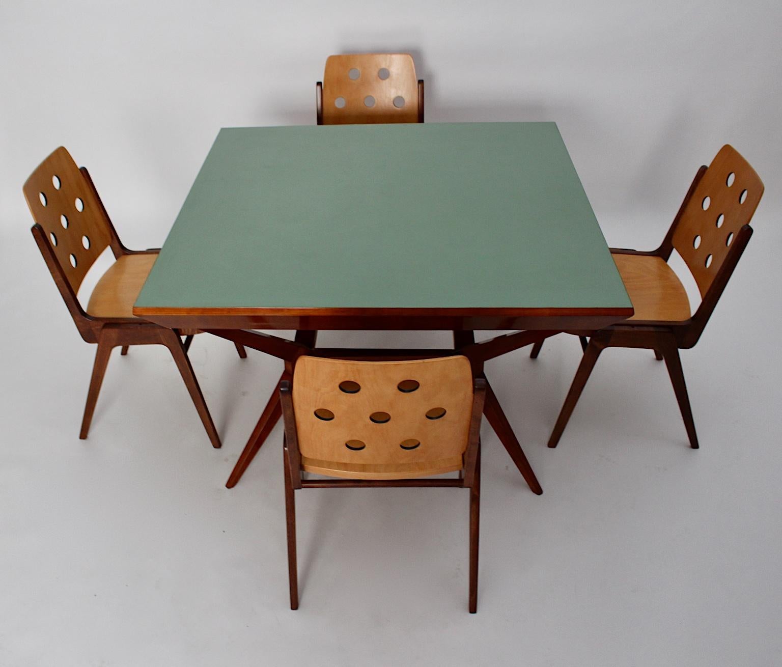 Mid-Century Modern vintage dining room set, which includes an outstanding dining table by Franz Schuster attributed and a set of 4 dining chairs by Franz Schuster 1950s Vienna.
The dining table or center table was made out of a solid cherrywood