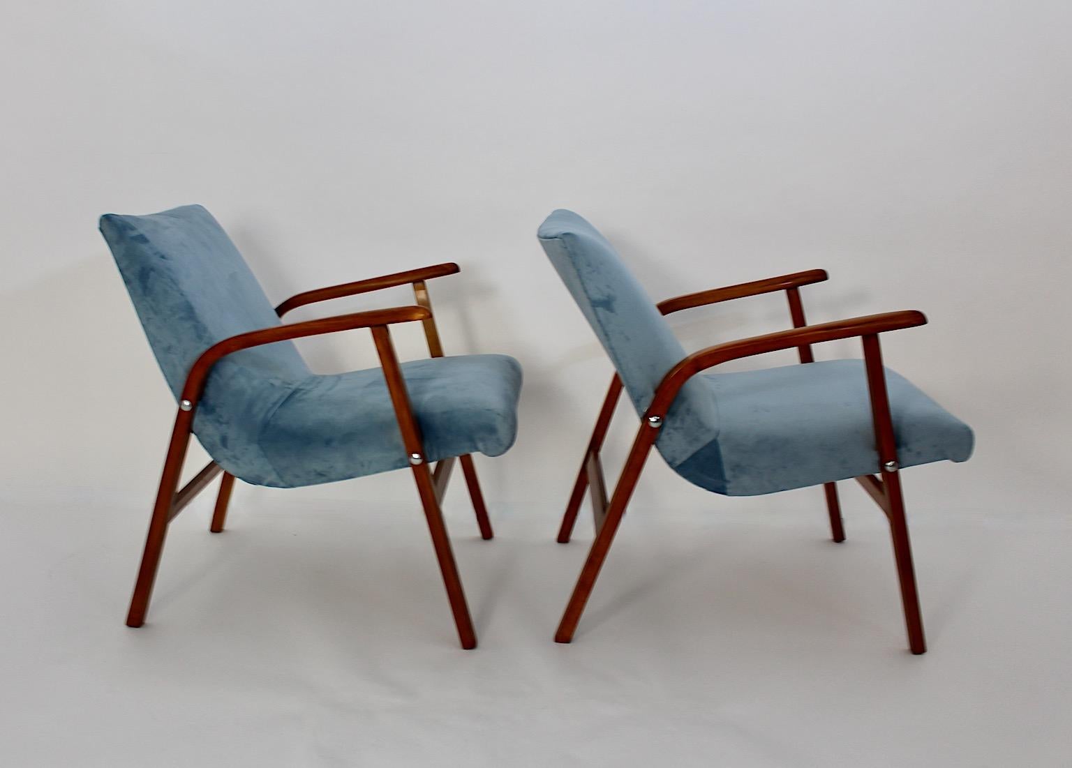 Mid Century Modern Modernist freestanding vintage pair armchairs from beech and pastel blue velvet by Roland Rainer for Cafe Ritter 1950s Vienna.
An amazing and iconic pair or duo armchairs from beechwood and newly covered seat and back with pastel