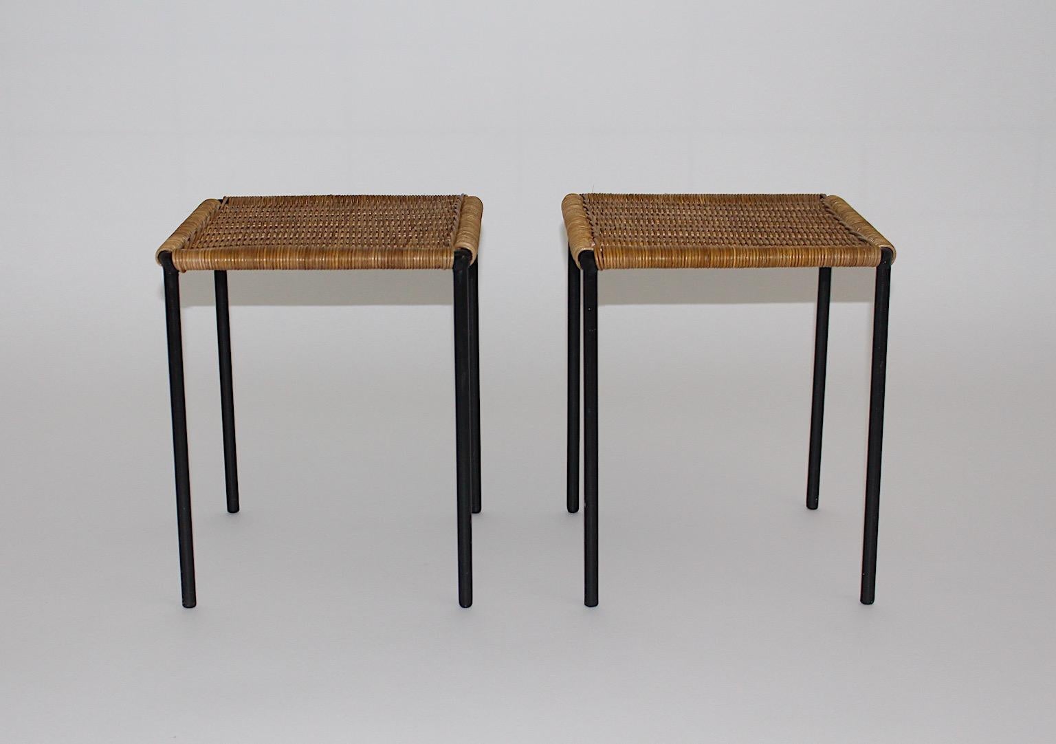 Mid Century Modern vintage authentic duo pair of organic rectangular side tables or sofa tables from rattan and black lacquered metal by Carl Auböck, 1950s Austria.
A pair of tables or sofa tables, which show rattan network and black lacquered