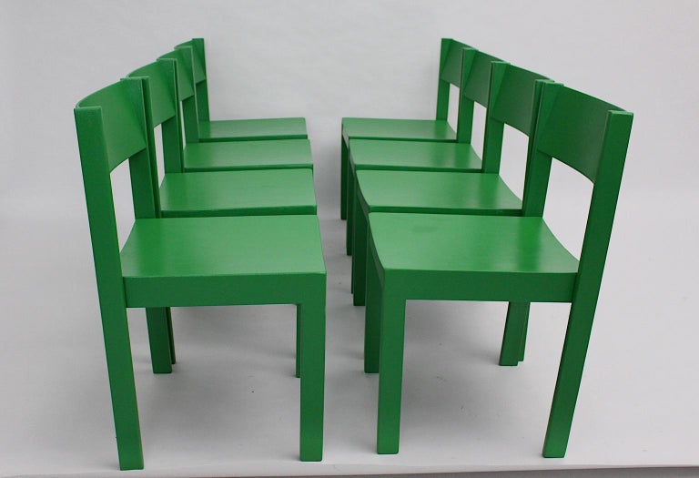 Mid Century Modern eight vintage dining chairs from beechwood 1950s Vienna in green color tone.
The set of eight dining chairs are stackable, the seating comfort is very good, furthermore the dining chairs are stable and sturdy.
The condition is