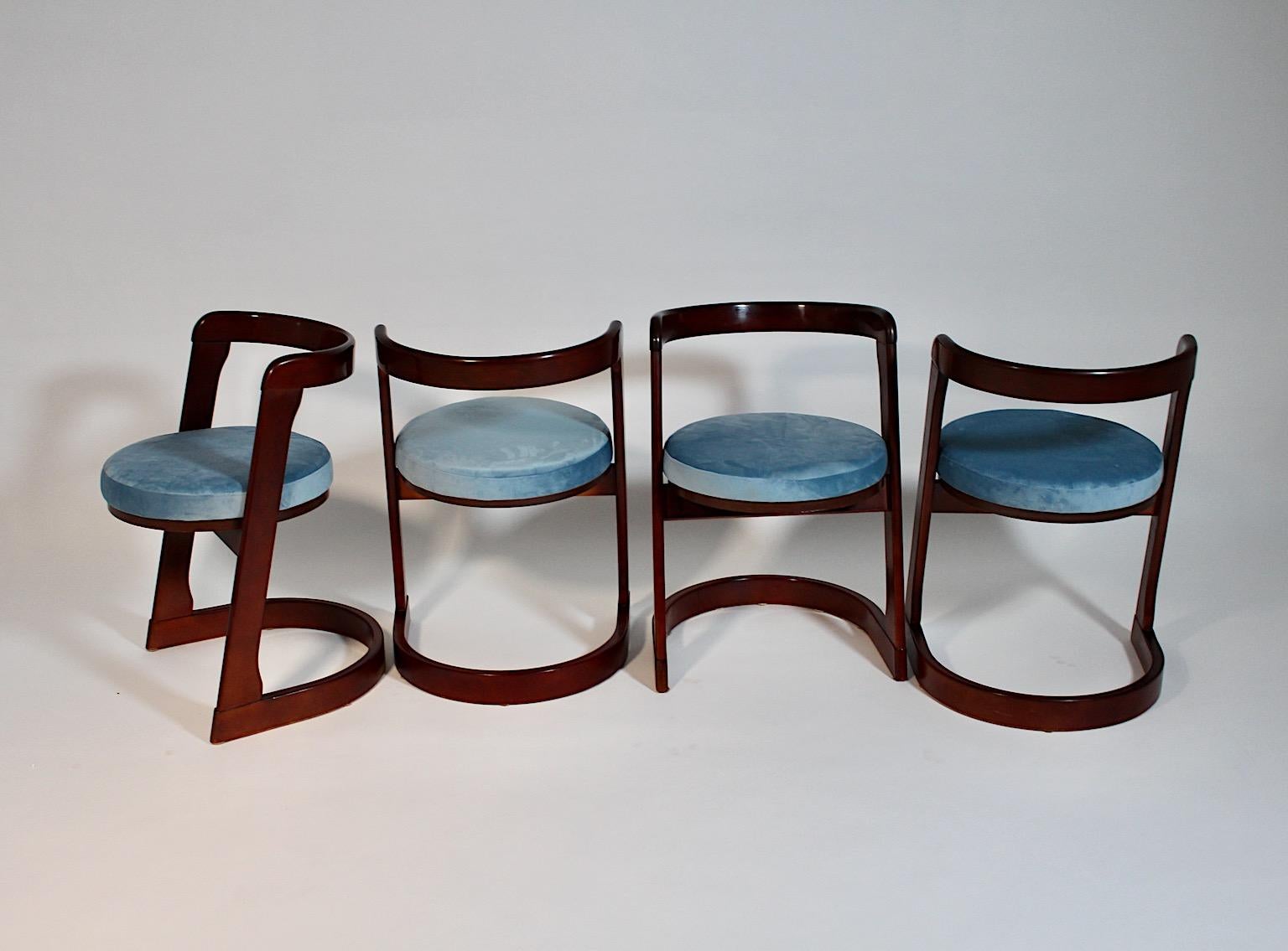 Mid-Century Modern vintage set of four ( 4 ) dining room chairs from brown stained beech and upholstered seats new covered with blue velvet by Willy Rizzo 1960s Italy.
A beautiful set of 4 dining room chairs with brown stained beech frame and new