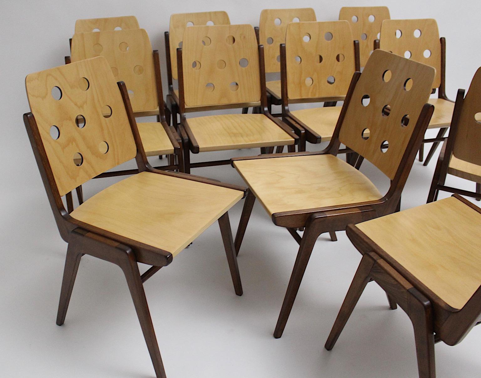Mid Century Modern vintage authentic twelve ( 12 ) dining chairs from beech and plywood in bicolor blonde and brown color by Franz Schuster, 1050s Vienna.
An iconic set of twelve 12 dining chairs or chairs by Franz Schuster in beautiful shape with