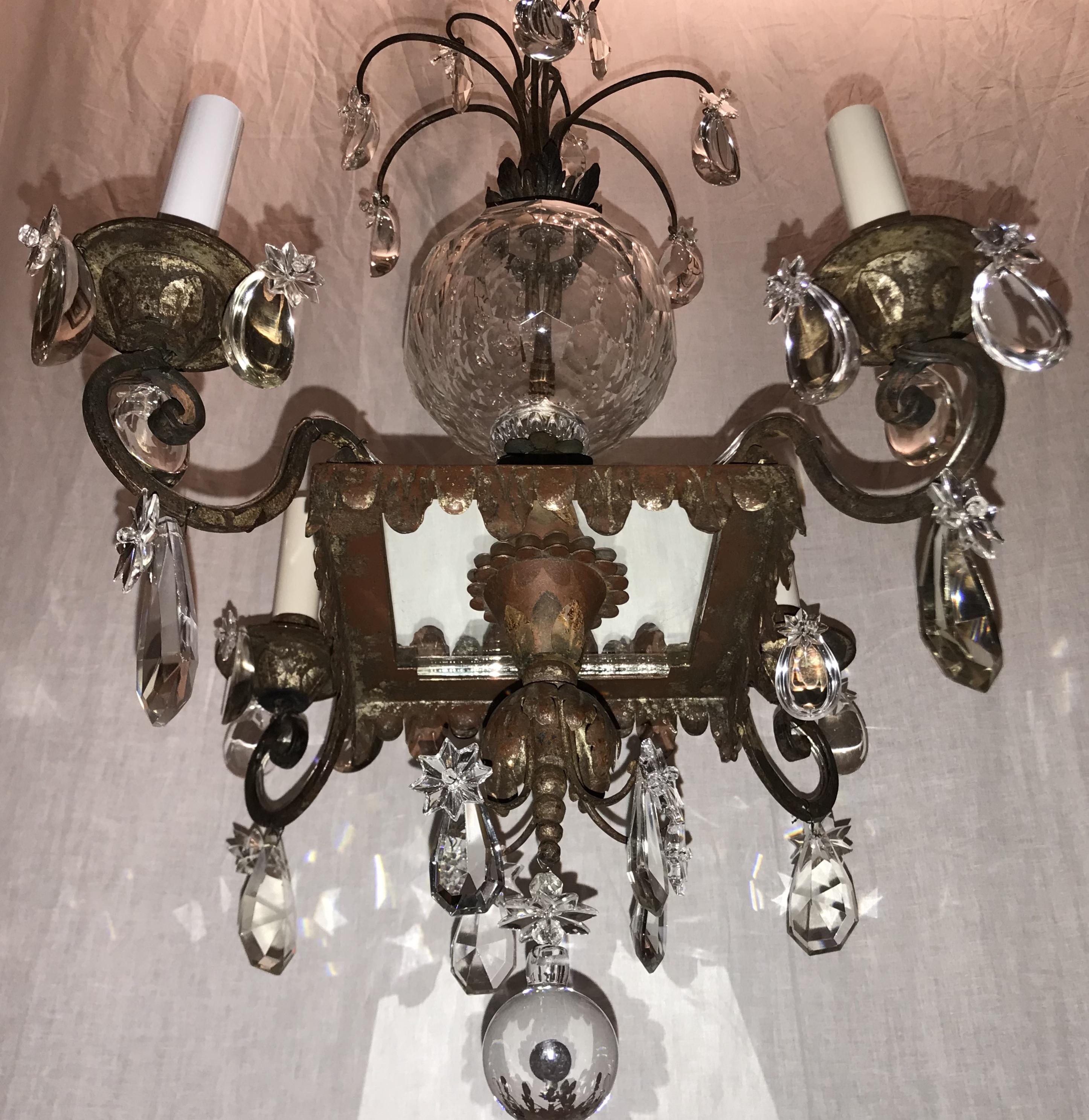 A wonderful Mid-Century Modern vintage French star and large crystal ball centre and embellished with crystal drops, with the original silver gilt square frame mirrored bottom chandelier having four lights, completely rewired.
In the manner and