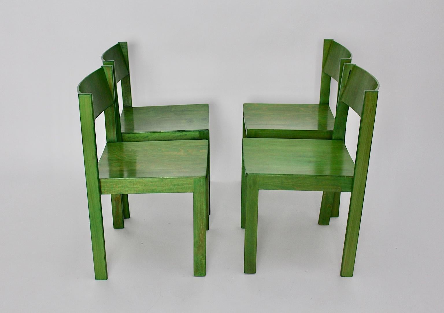 Mid Century Modern set of four vintage dining chairs executed by E. & A. Pollak, Austria, which were made of green stained and lacquered beechwood and plywood.
The dining chairs are also stackable!
With a happy color and a nice shape show these