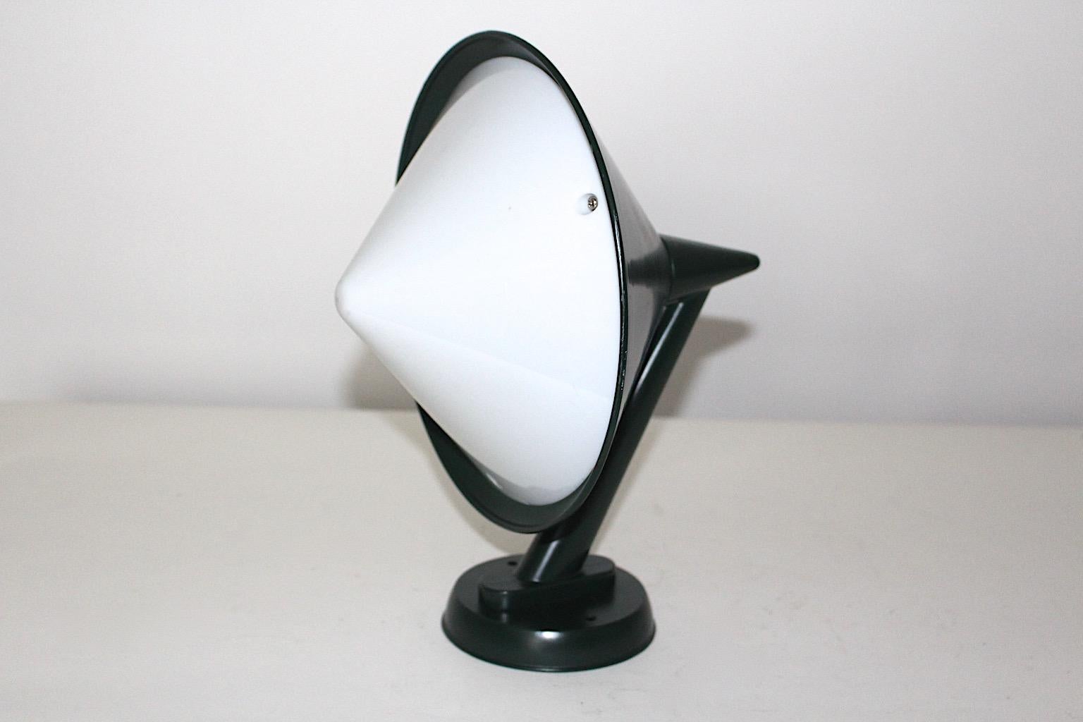Mid Century Modern vintage sconce or wall light from metal in fir green color tone and white acrylic shade by Svea Winkler 1960s for Orno, Finland.
Wonderful design combination with geometric forms perfect for indoor and outdoor.
Svea Winkler (