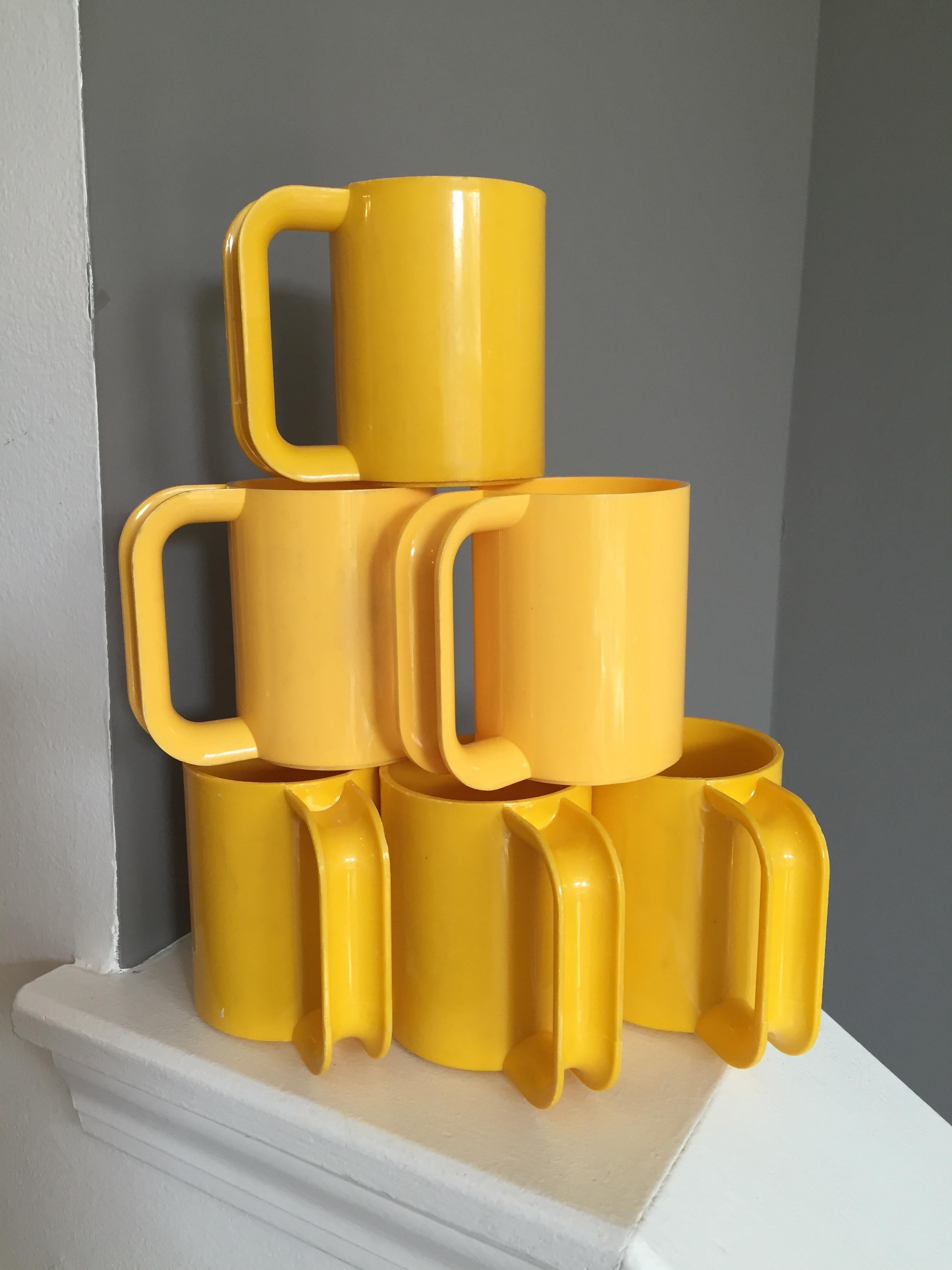 Mid-Century Modern Vintage Heller Ware Massimo Vignelli mugs - 6
School bus yellow, these iconic Massimo Vignelli melamine mugs will add a bright accent to any kitchen.

Set of 6, these vintage mugs are a wonderful find! 

Dimensions: 4.5