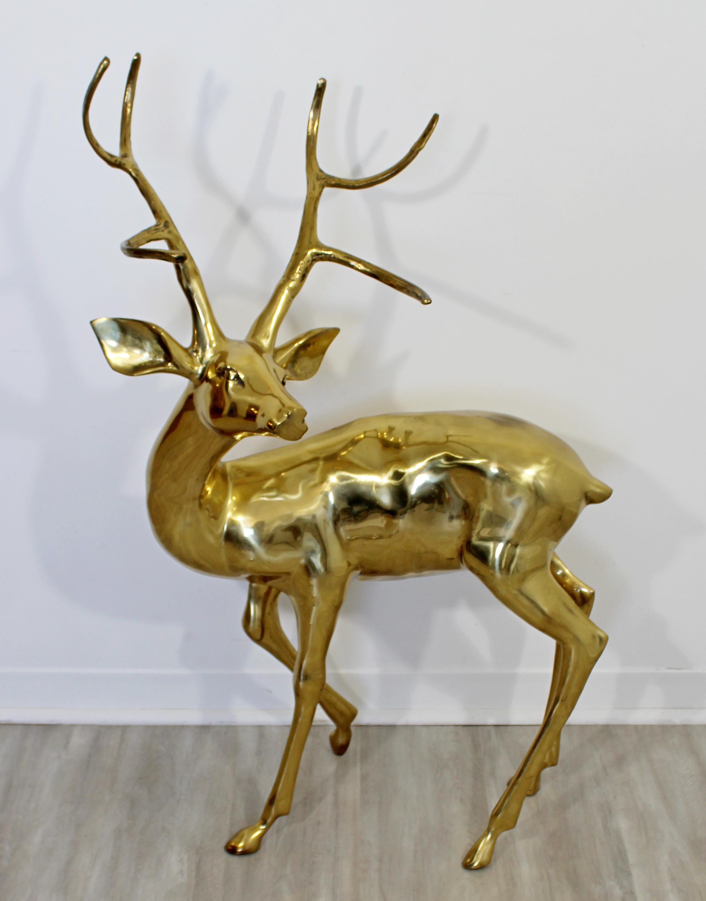 For your consideration is an elegant, brass floor sculpture of a stag with large antlers, circa 1960s. In excellent condition, with a patina to match its age. The dimensions are 25
