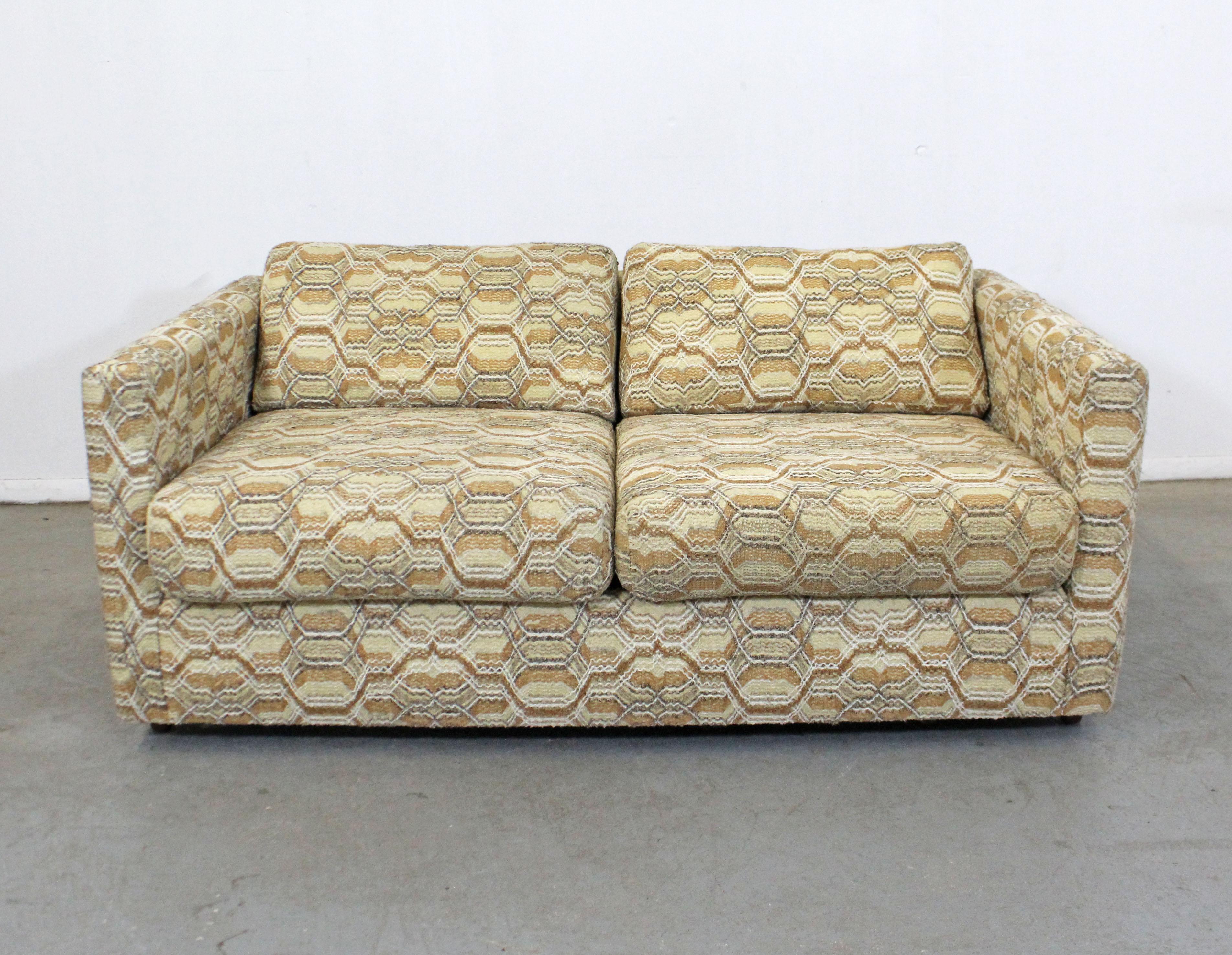 Offered is a vintage Mid-Century Modern style love-seat with textured upholstery. Have removable seat and back cushions and an extra pillow. It is in good condition for its age with slight age wear, no stains or tears in upholstery. It is marked by