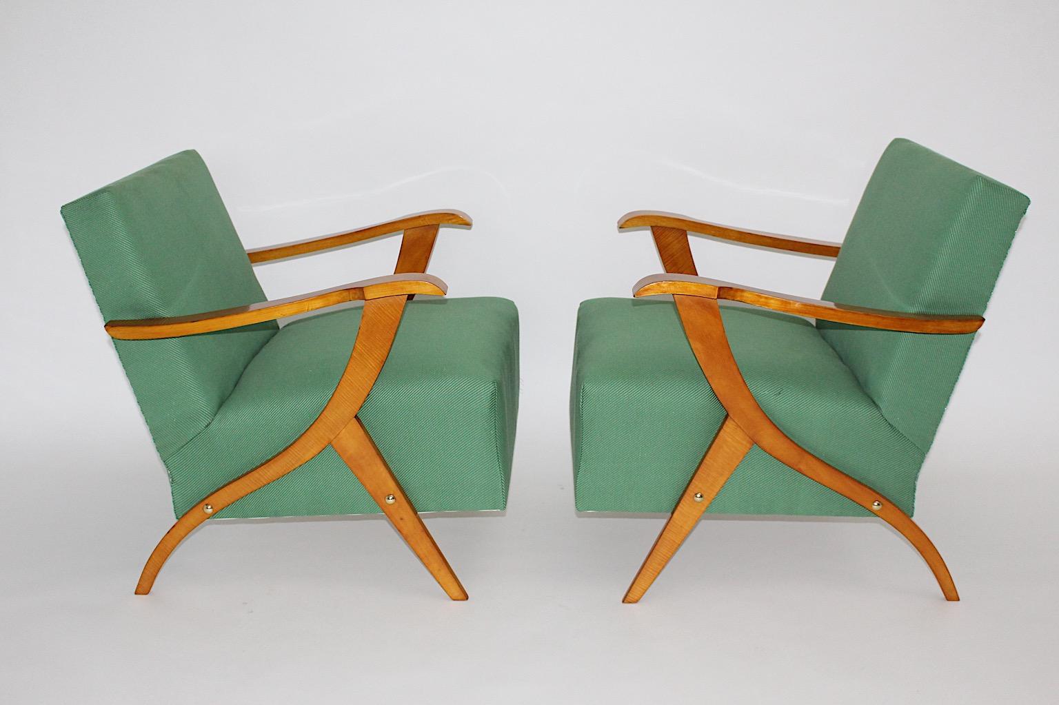 Mid century modern vintage lounge chairs a pair from maple tree and spruce design in style of Carlo Mollino in Italy, 1950s.
A beautiful pair of lounge chairs in organic sculptural shape from maple tree, spruce, brass and textile fabric.
While the
