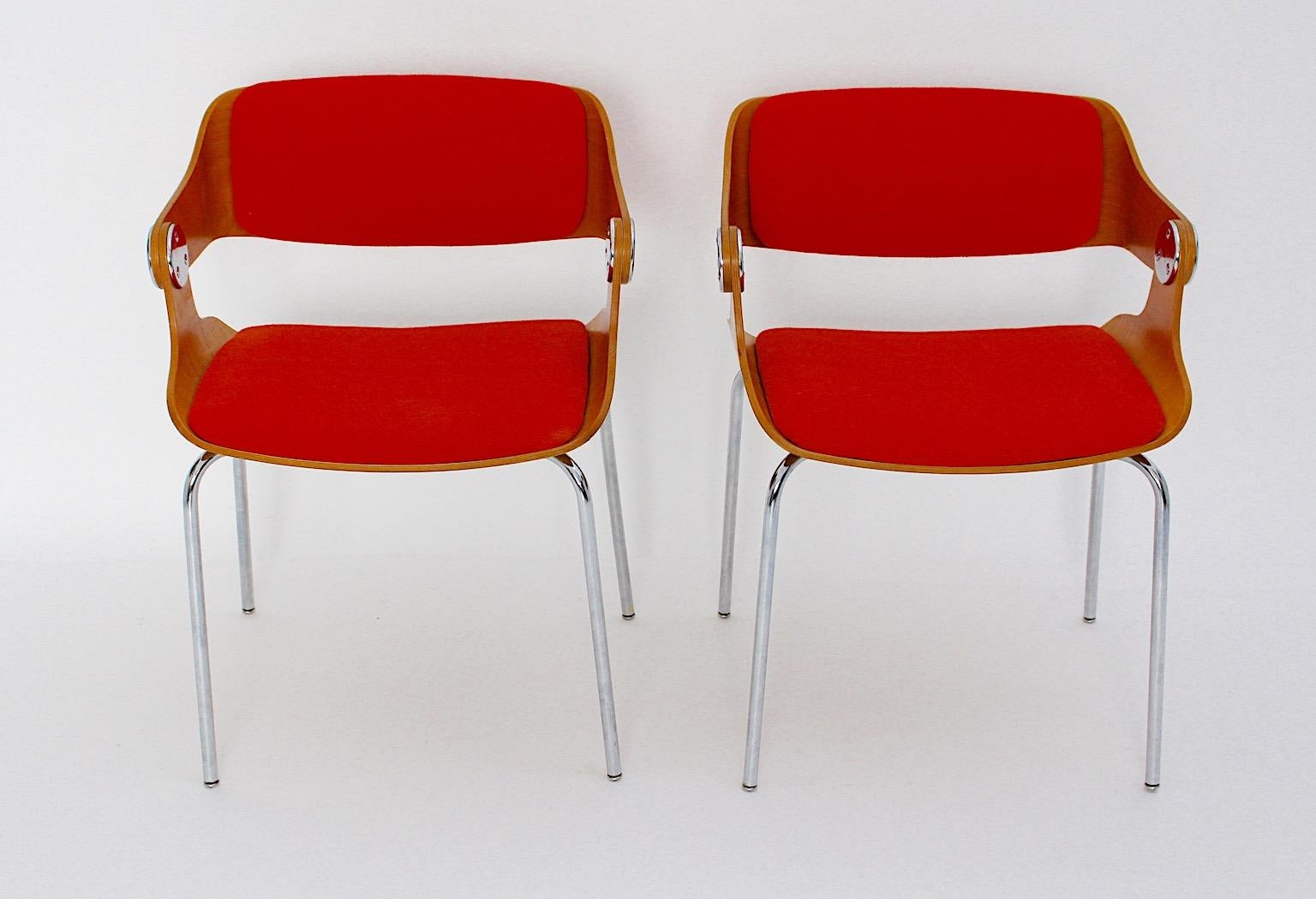 Mid Century Modern vintage dining chairs pair or duo from chromed metal, bentwood and upholstered seat and back from woolen textile fabric in orange color by Eugen Schmidt, circa 1965 Germany. 
A beautiful pair of dining chairs features a seat shell