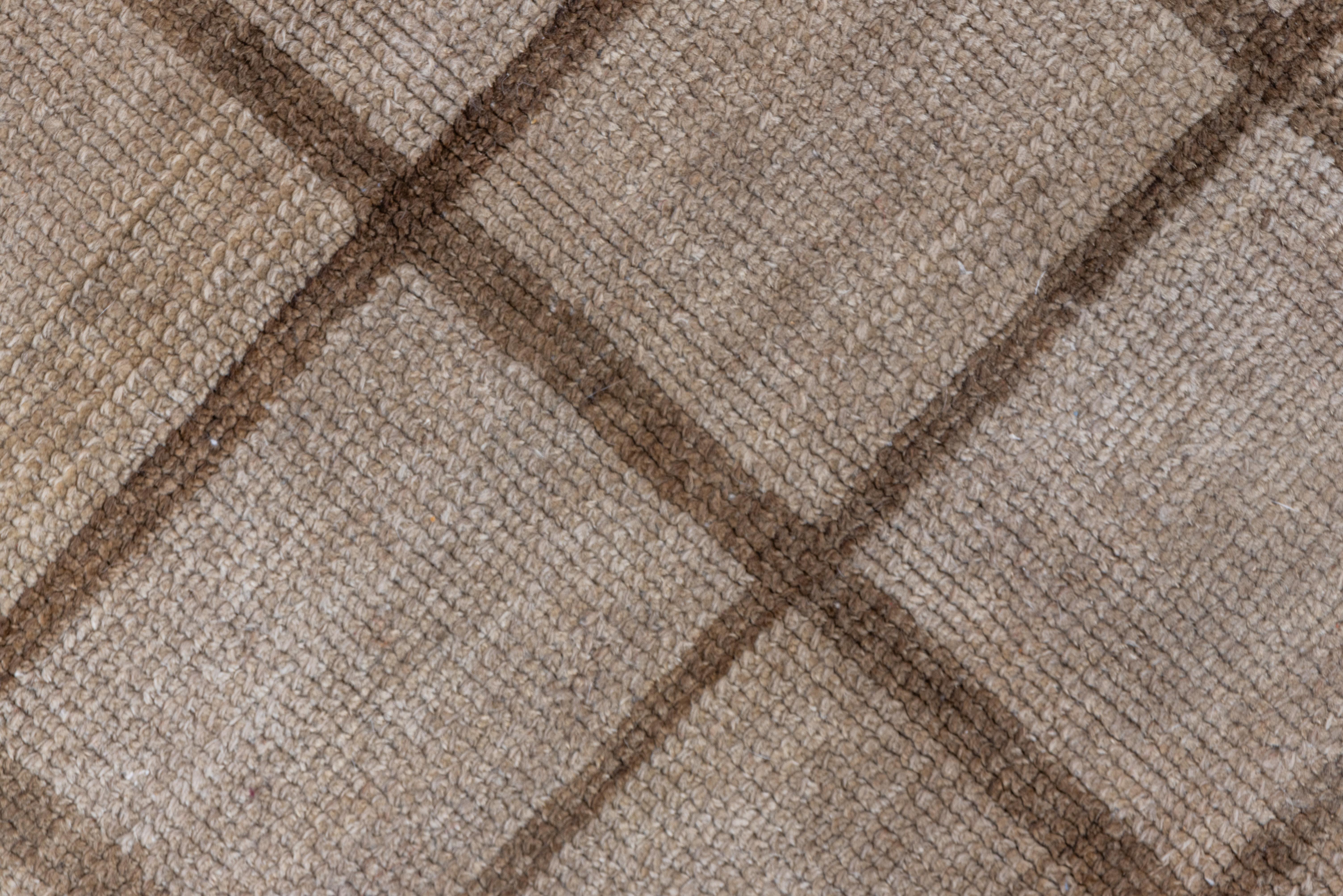 A windowpane square grid design in medium brown is set on the abrashed and slightly cloud-variegated beige field with a narrow brown outer line enclosing it all. Good condition. Minimalist design in sync with Mid-Century Modern furniture.
 