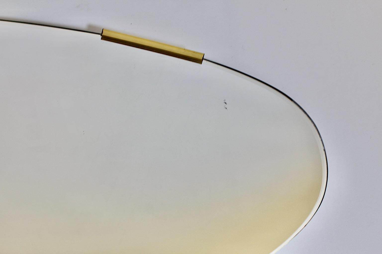 20th Century Mid Century Modern Vintage Oval Floor Mirror Frameless Brass Clasps 1950s Italy For Sale